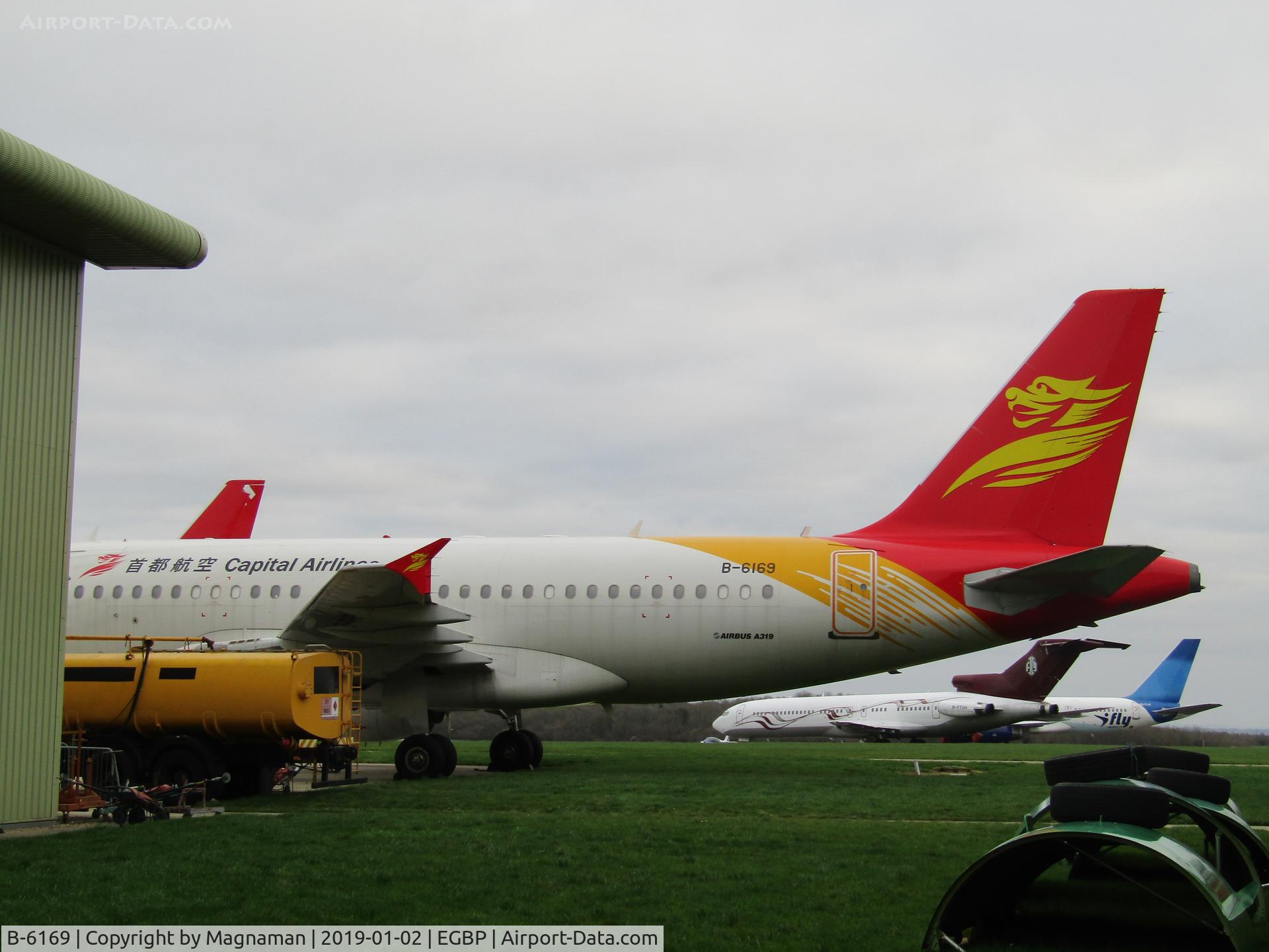 B-6169, 2006 Airbus A319-112 C/N 2985, next to hangar awaiting dismantling