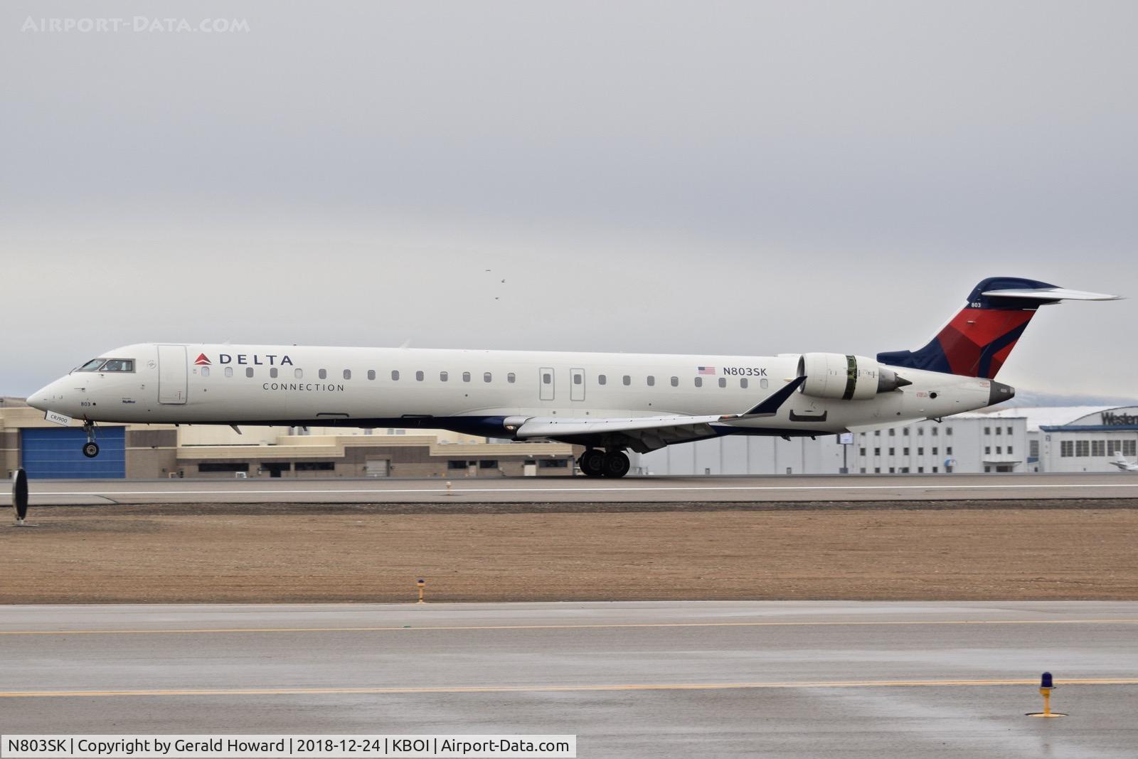 N803SK, 2006 Bombardier CRJ-900ER (CL-600-2D24) C/N 15062, Landing roll out on RWY 10L.