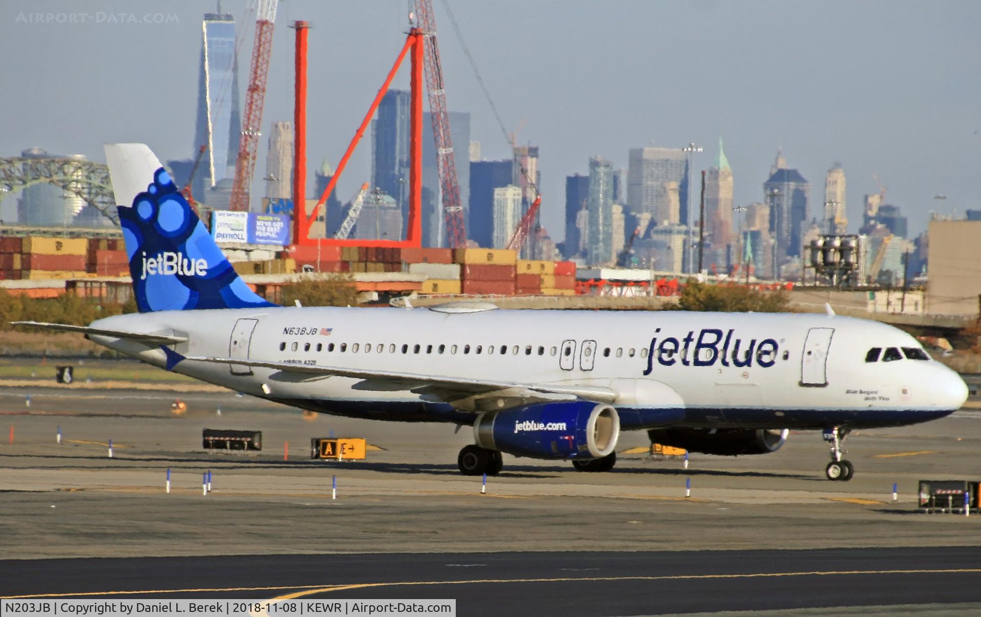 N203JB, 2006 Embraer 190AR (ERJ-190-100IGW) C/N 19000023, Pulling into Newark International