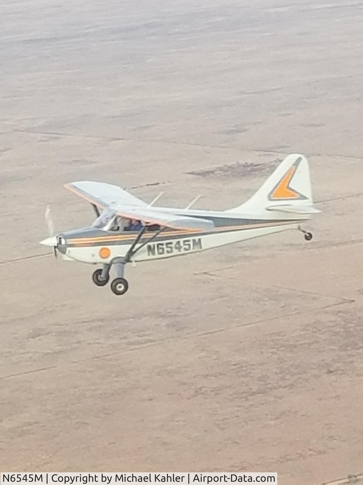 N6545M, 1948 Stinson 108-3 Voyager C/N 108-4545, KPUB in flight