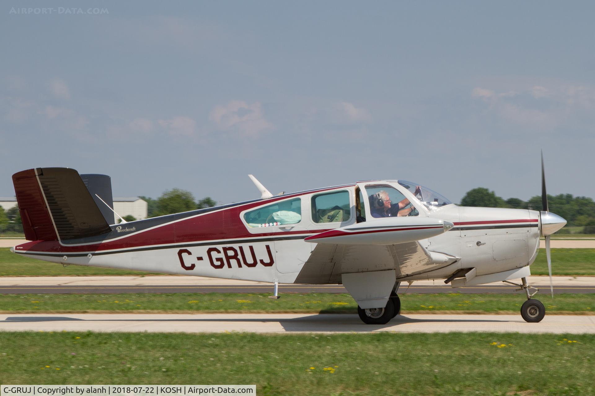 C-GRUJ, 1956 Beech G35 Bonanza C/N D-4502, Taxying at AirVenture 2018