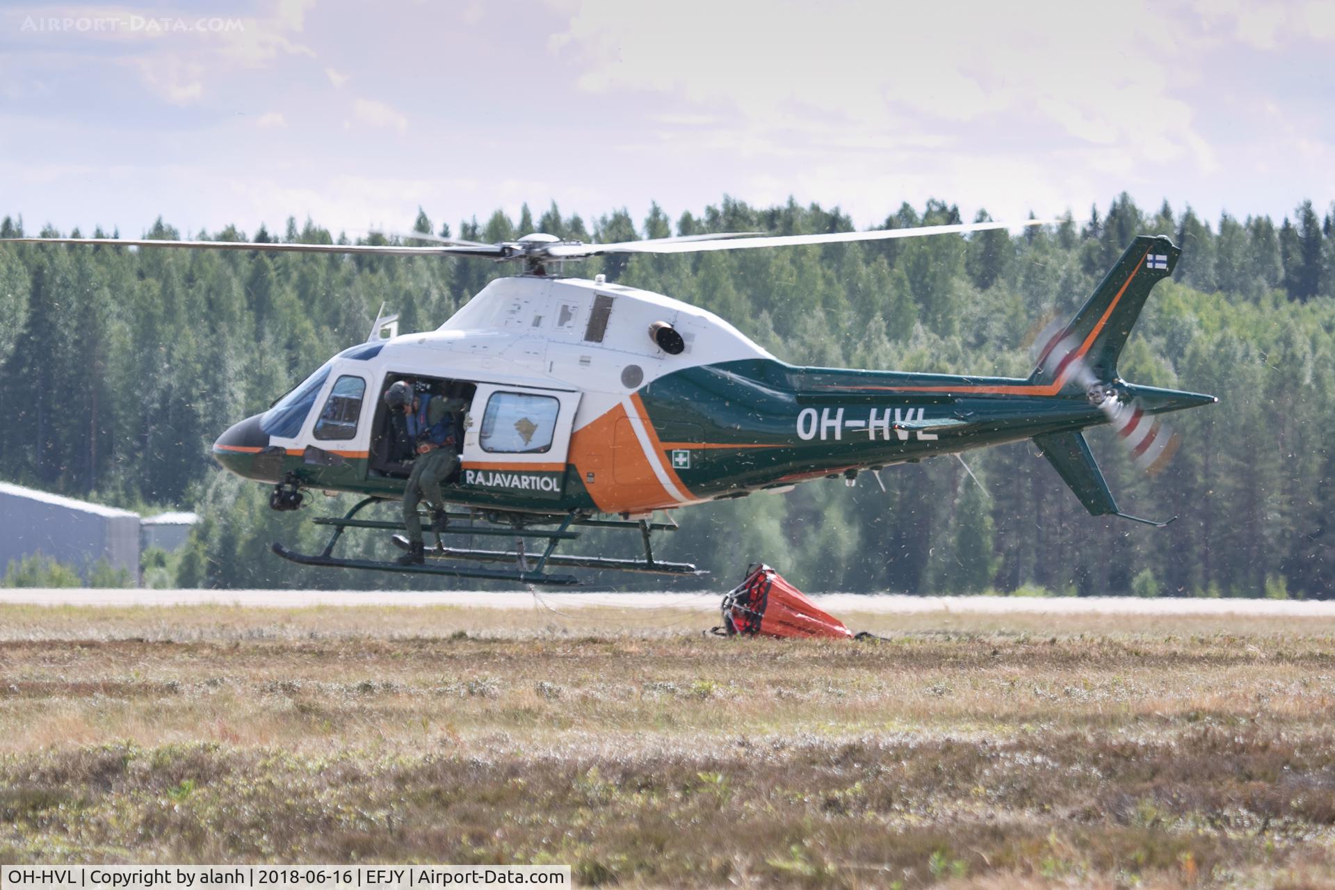 OH-HVL, AgustaWestland AW-119Ke Koala C/N 14733, Dropping the bucket after performing a water drop at the Finnish Air Force 100th Anniversary air show