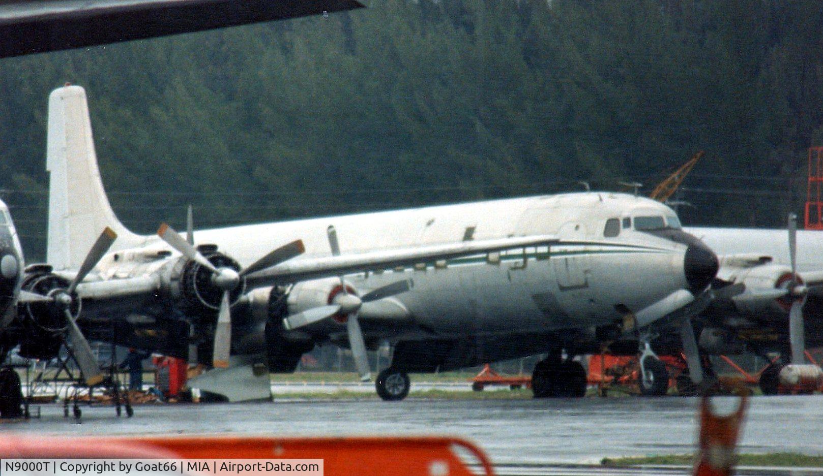 N9000T, 1957 Douglas DC-7CF Seven Seas C/N 45119, Sitting on the MIA Conner Av. ramp, March 1990