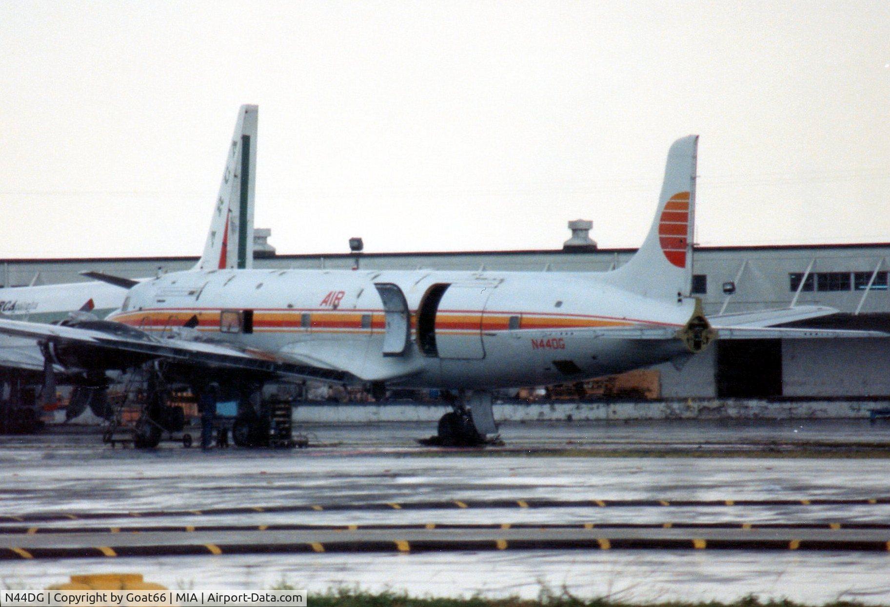 N44DG, 1957 Douglas DC-6A C/N 45373, Awaiting attention at MIA during March 1990 and displaying the part titlle and colours of a previous opertator, PAT (Petroleum Air Transport)