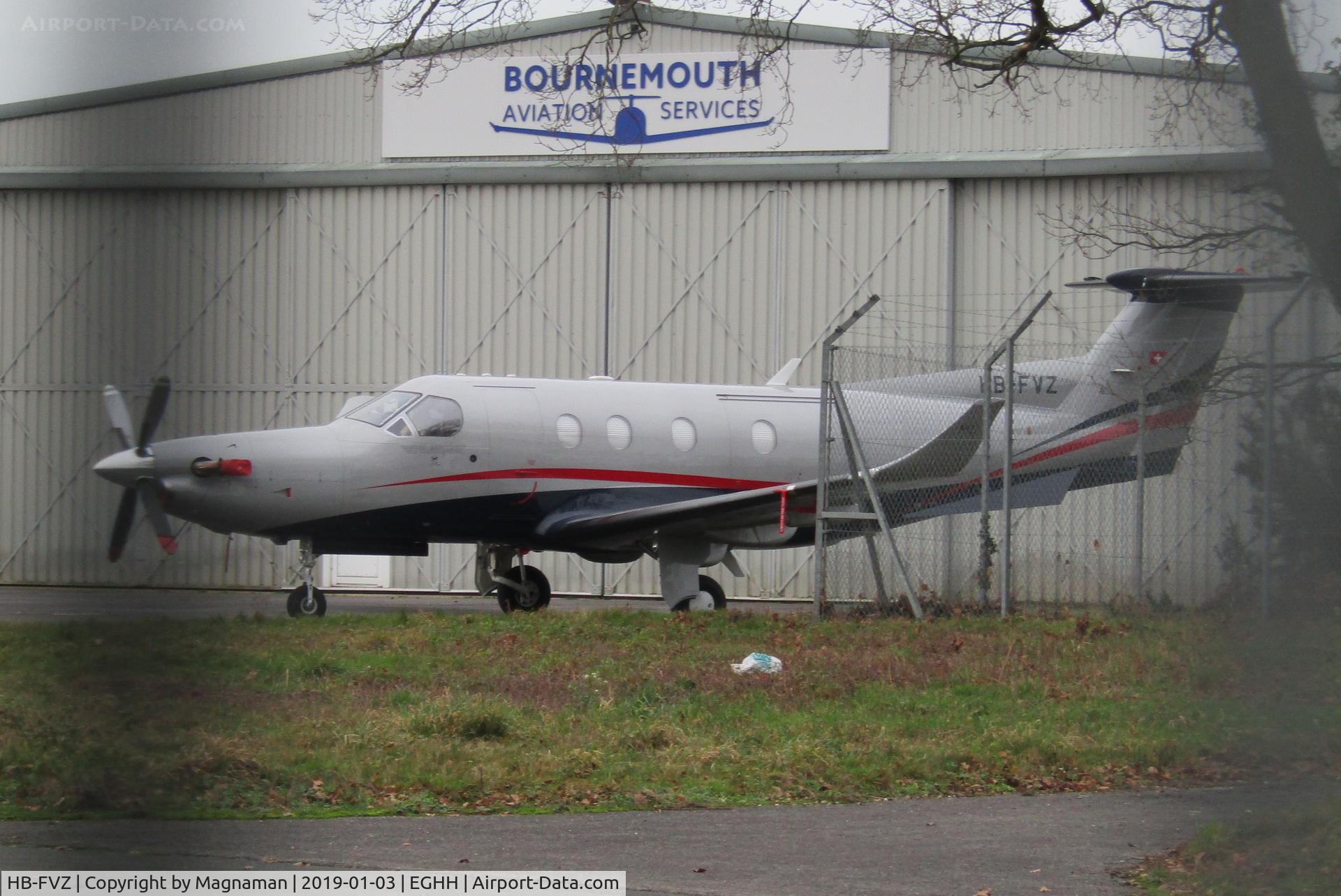 HB-FVZ, 2000 Pilatus PC-12 C/N 343, taken through securty grille at hurn