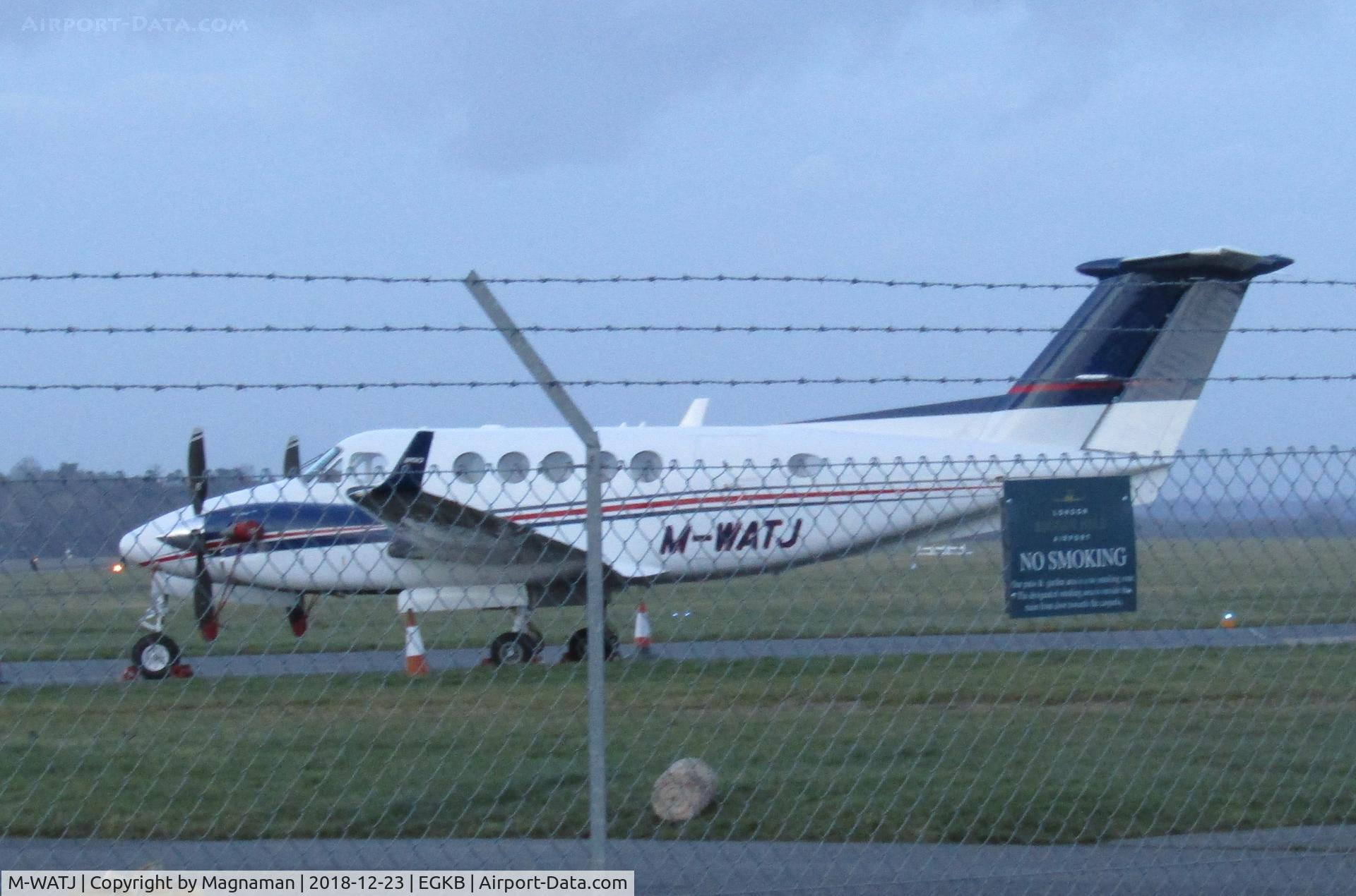 M-WATJ, 2012 Hawker Beechcraft B200GT King Air C/N BY-139, in gloom at Biggin