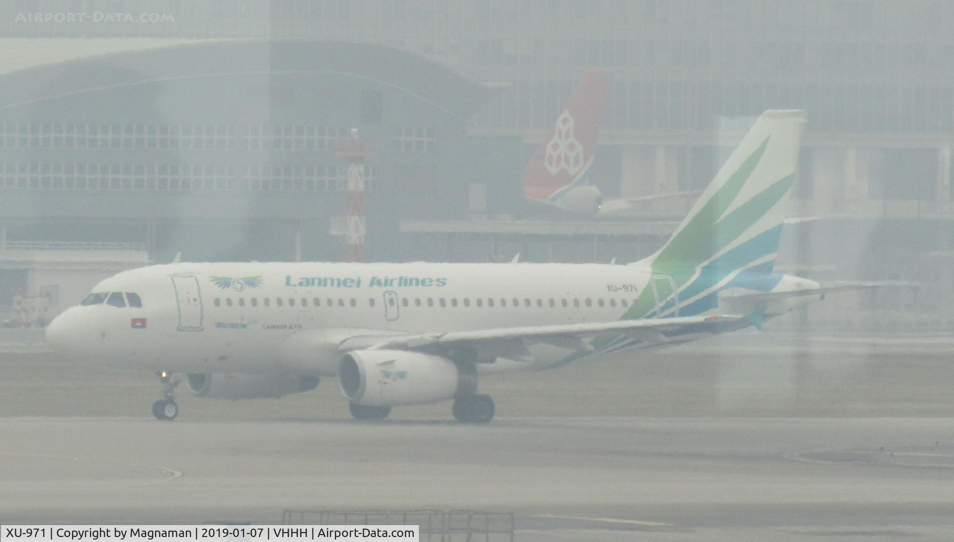 XU-971, 2006 Airbus A319-131 C/N 2720, in gloom at HKG