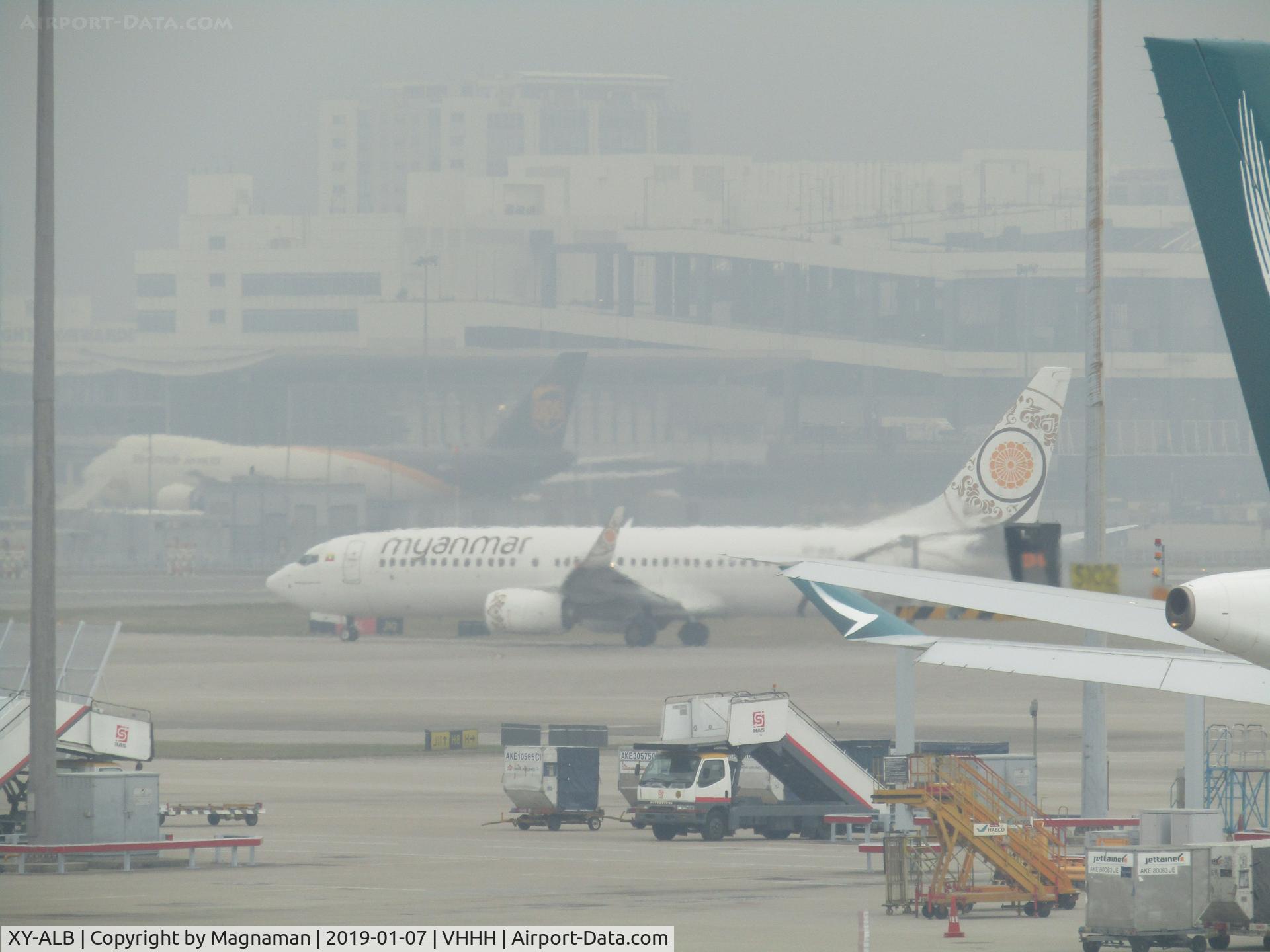 XY-ALB, 2015 Boeing 737-86N C/N 43405, in engine haze at HKG