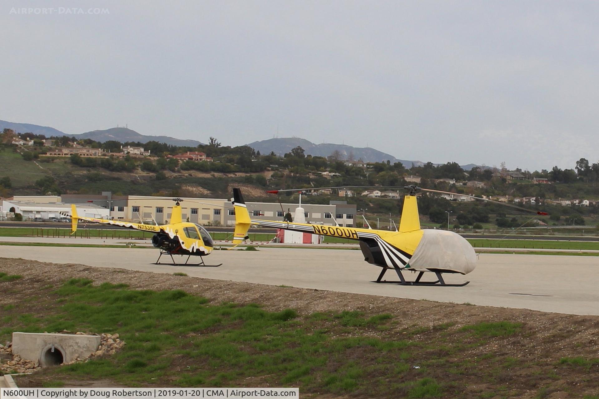 N600UH, 2014 Robinson R44 Raven II C/N 13695, 2014 Robinson Helicopter Company R44II RAVEN II, Lycoming O-360-J2A on SUNAIR RAMP with a 2006 N7535E Robinson R22 BETA, (a two for one shot). CMA's NavAid VOR/DME 115.8/345 deg./0 nm antenna in background center, (a three for one shot? LOL)