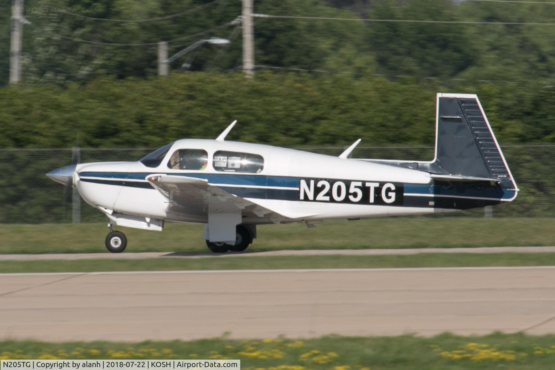 N205TG, 1987 Mooney M20J 201 C/N 24-3041, Arriving at AirVenture 2018 (in company with 60 other Mooneys)