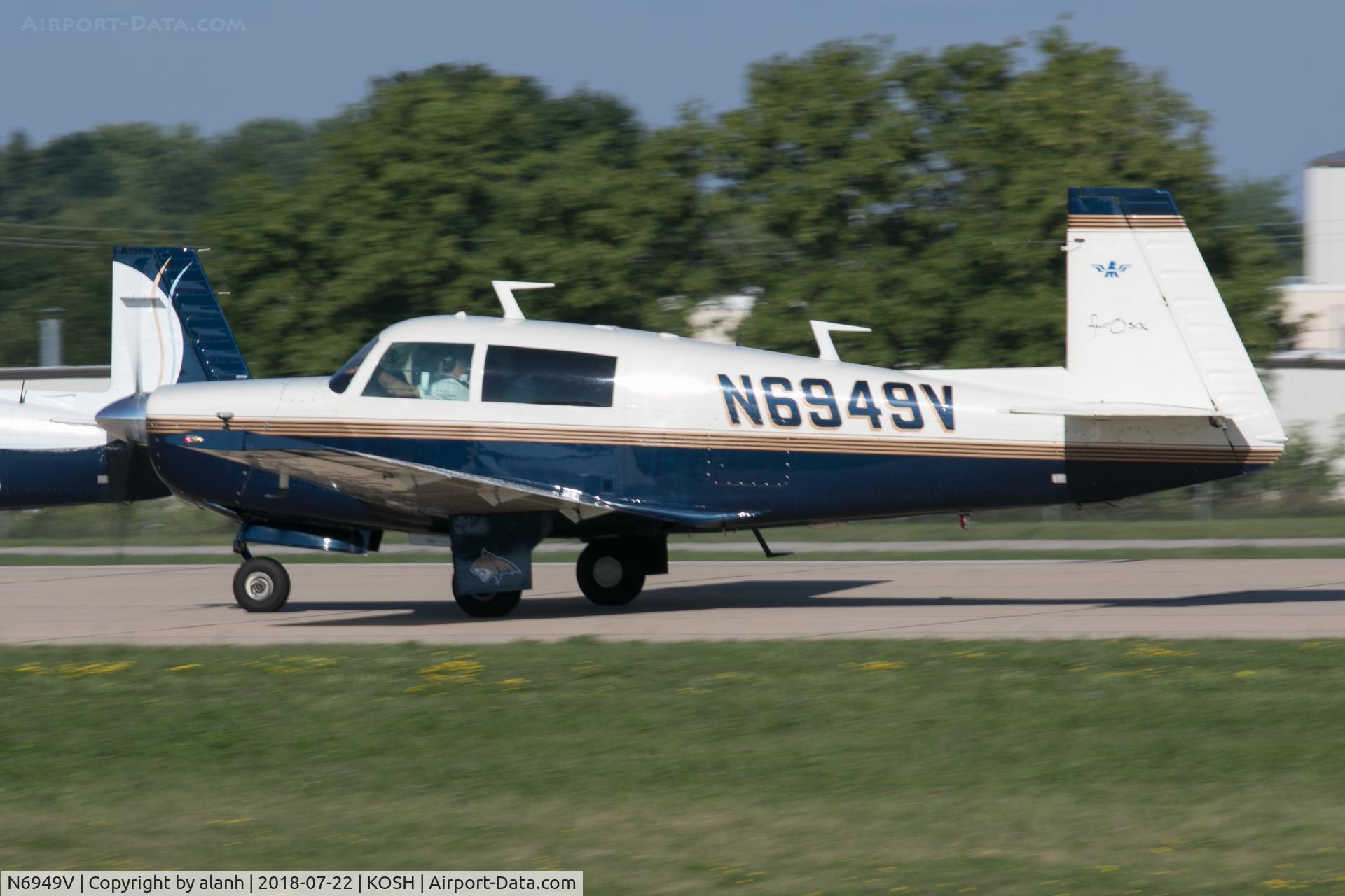 N6949V, 1975 Mooney M20F Executive C/N 22-1322, Arriving at AirVenture 2018 (in company with 60 other Mooneys)