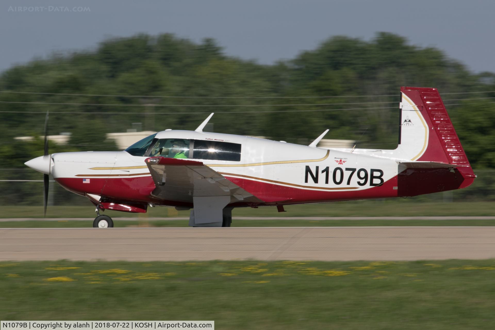 N1079B, 1981 Mooney M20K C/N 25-0577, Arriving at AirVenture 2018 (in company with 60 other Mooneys)