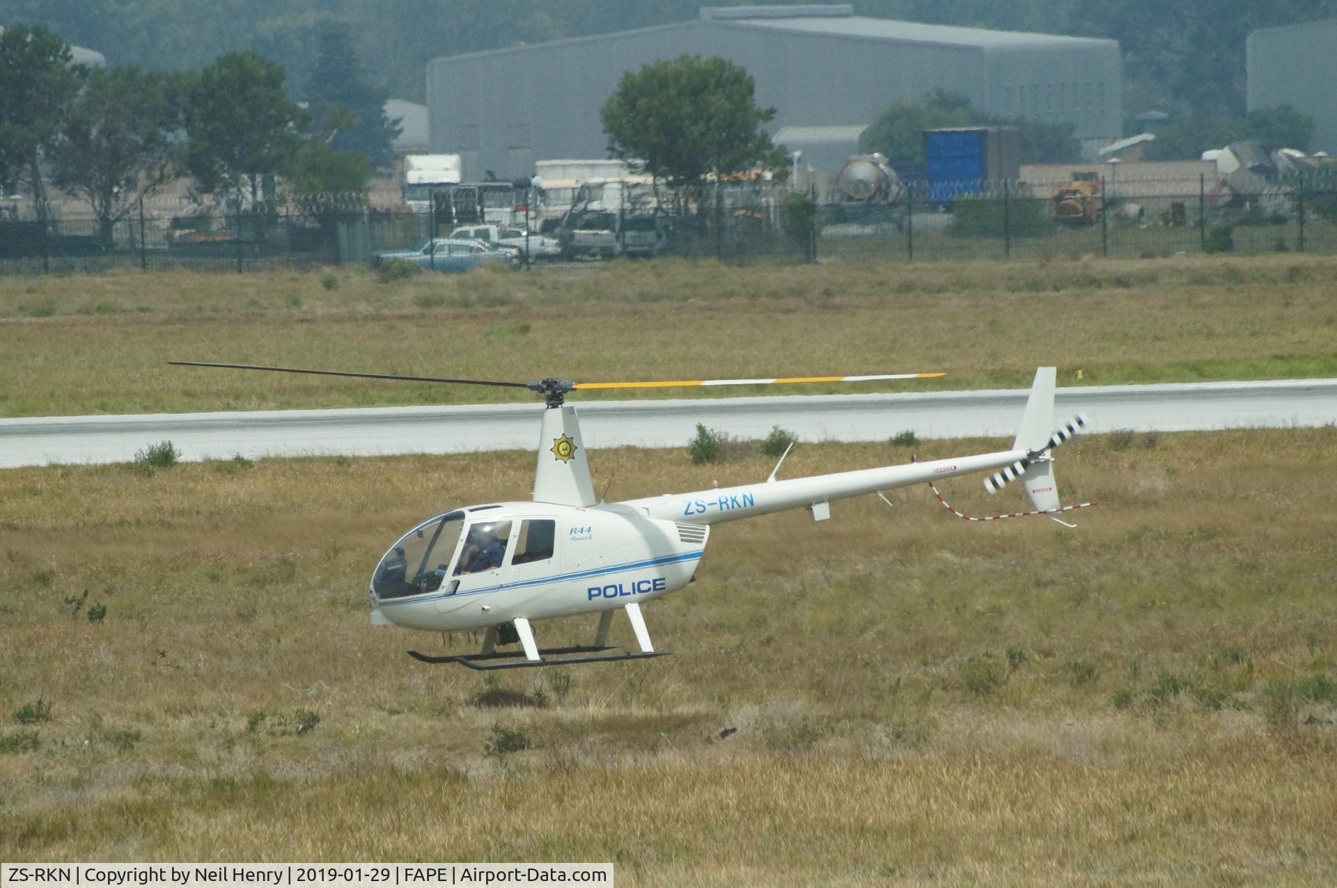 ZS-RKN, Robinson Raven 2, Seen at Port Elizabeth Airport on 29 January 2019.  Aircraft was being repeatedly lifted and landed as in practice movements.  Multiple photos taken from second floor window in 'Wimpy' restaurant with 300mm tele lens..