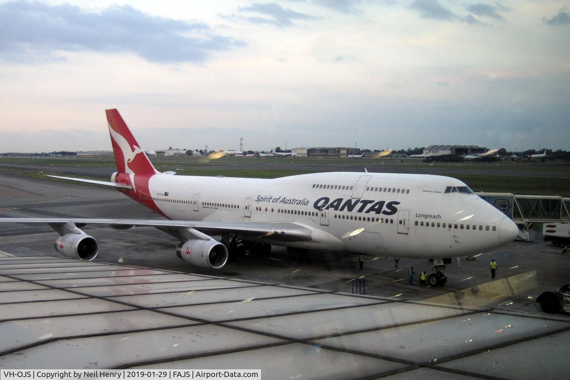 VH-OJS, 1999 Boeing 747-438 C/N 25564, Seen from Terminal 'A' at Johannesburg, in failing light,