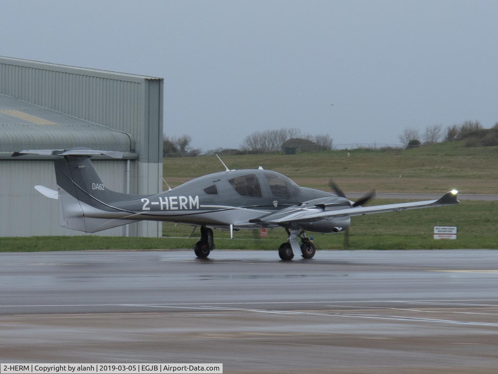 2-HERM, 2018 Diamond DA-62 C/N 62.103, Leaving the west parking at Guernsey for departure