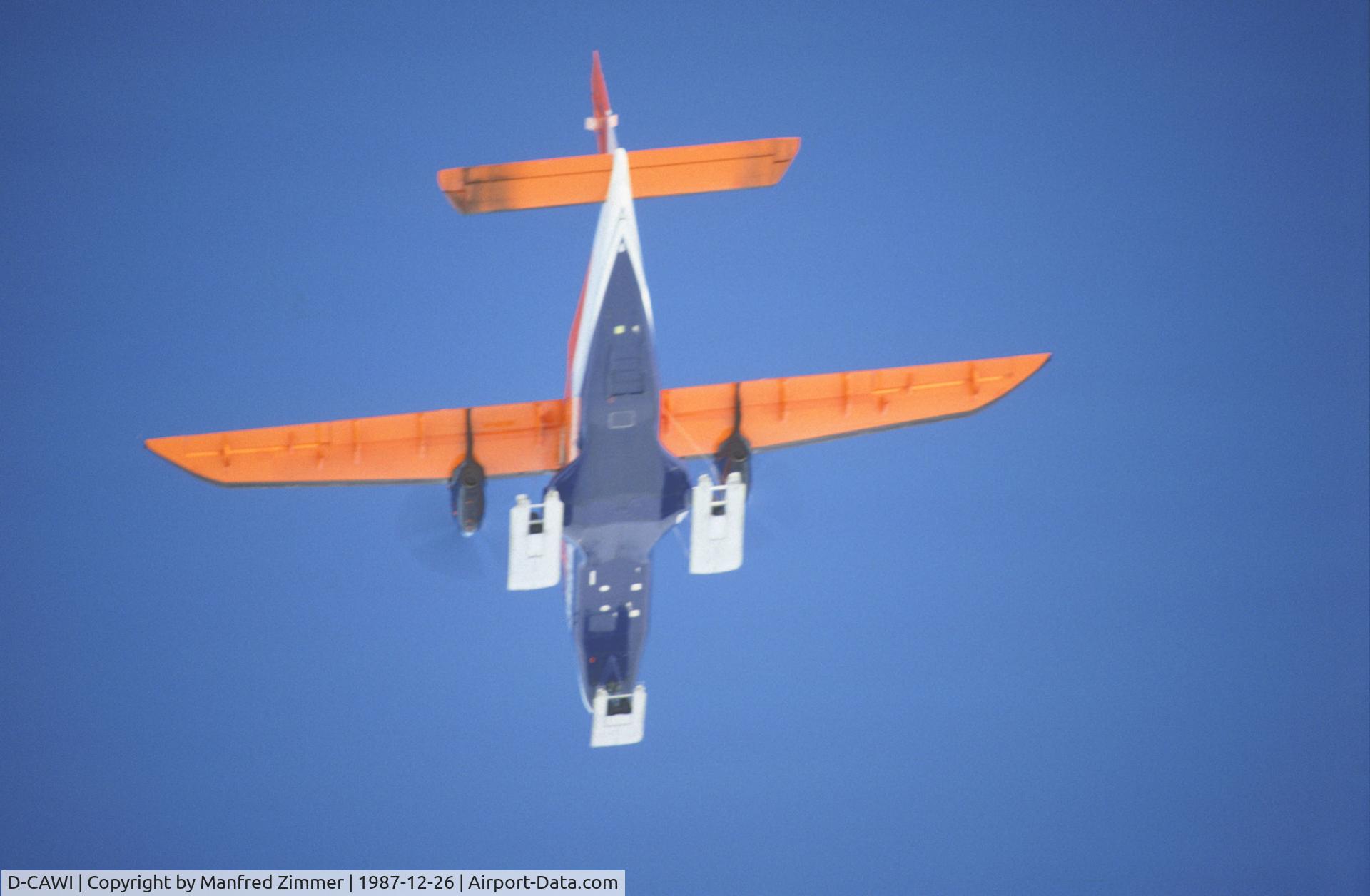 D-CAWI, 1983 Dornier 228-101 C/N 7014, POLAR 2 D-CAWI viewed from below flying POLAR 4 D-CICE during flight from Puerto Williams SCGZ (Chile) to british antarctic station Rothera. The wheels of the landing gears are positioned on movable plates of the ski for landing on snow.