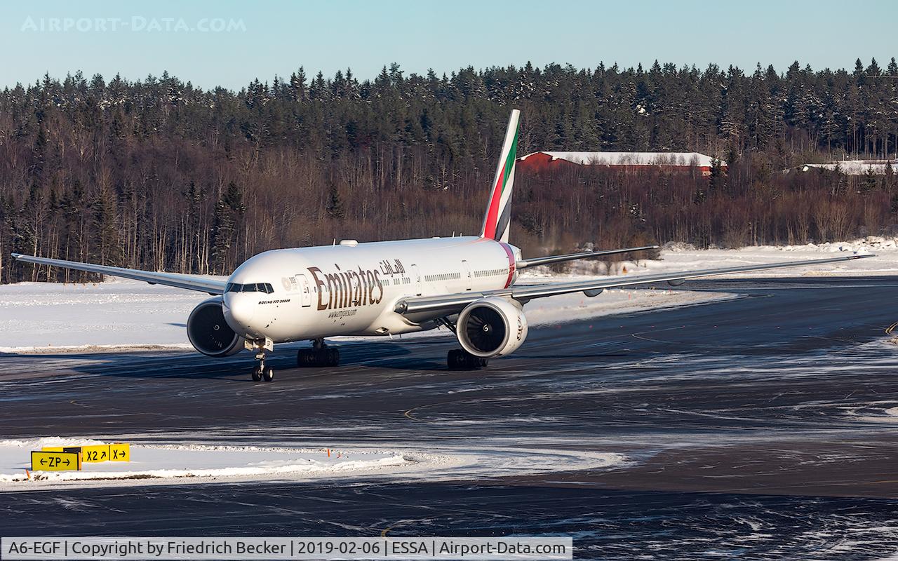 A6-EGF, 2011 Boeing 777-31H/ER C/N 38987, vacating runway 26