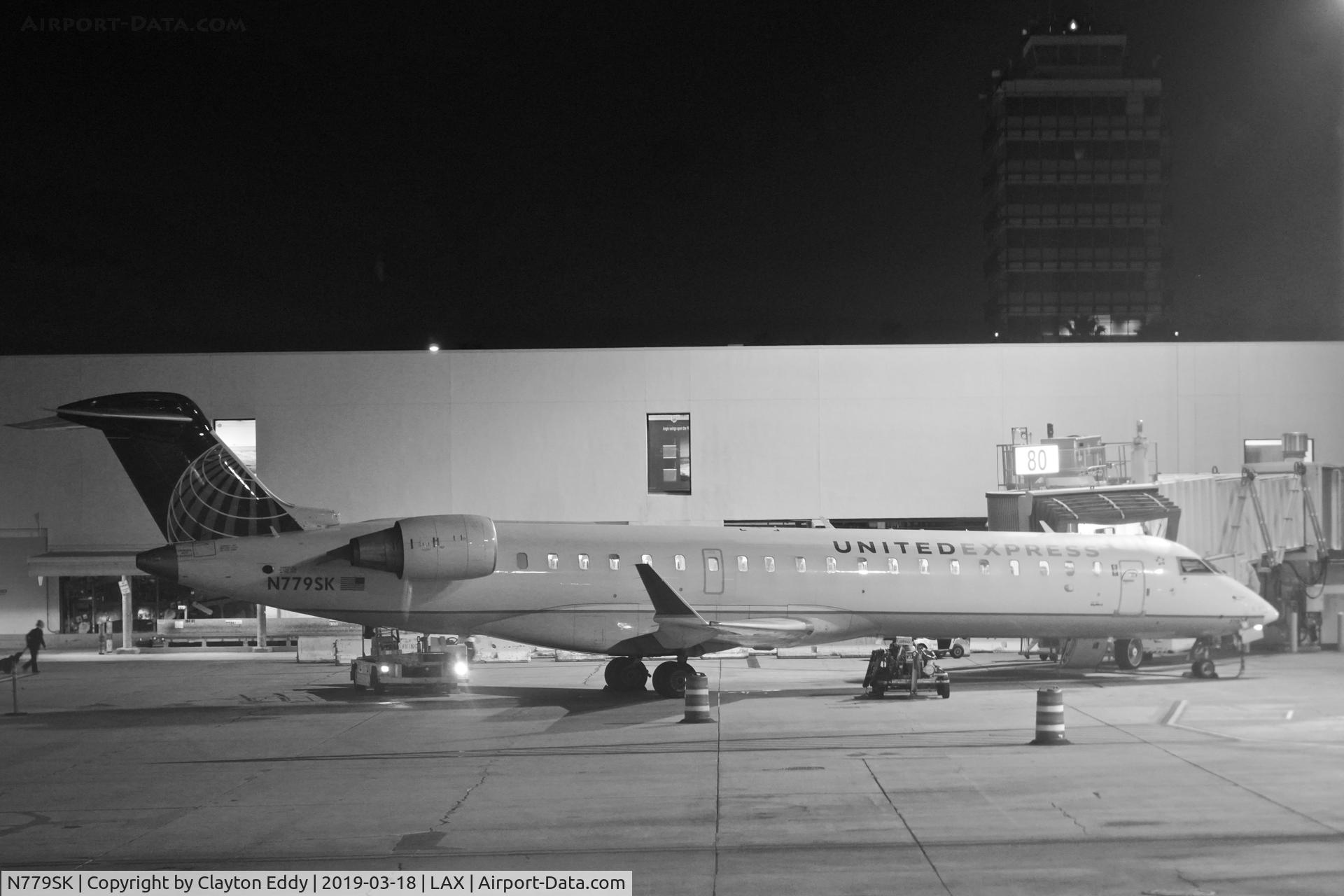 N779SK, 2009 Bombardier CRJ-702 (CL-600-2C10) Regional Jet C/N 10276, Night time. LAX 2019.