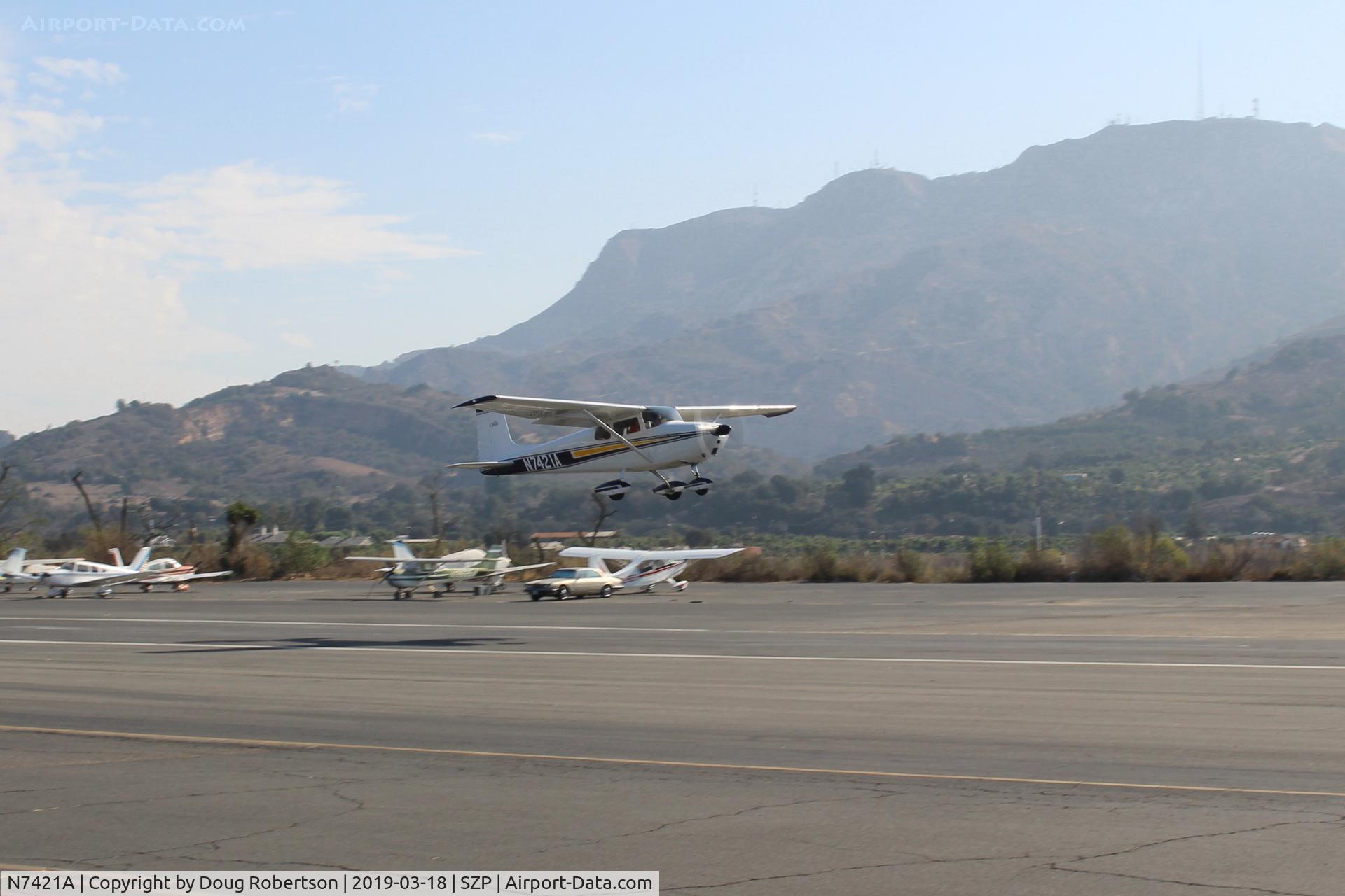 N7421A, 1956 Cessna 172 C/N 29521, 1956 Cessna 172, Continental O-300 145 Hp 6 cylinder, takeoff climb Rwy 22