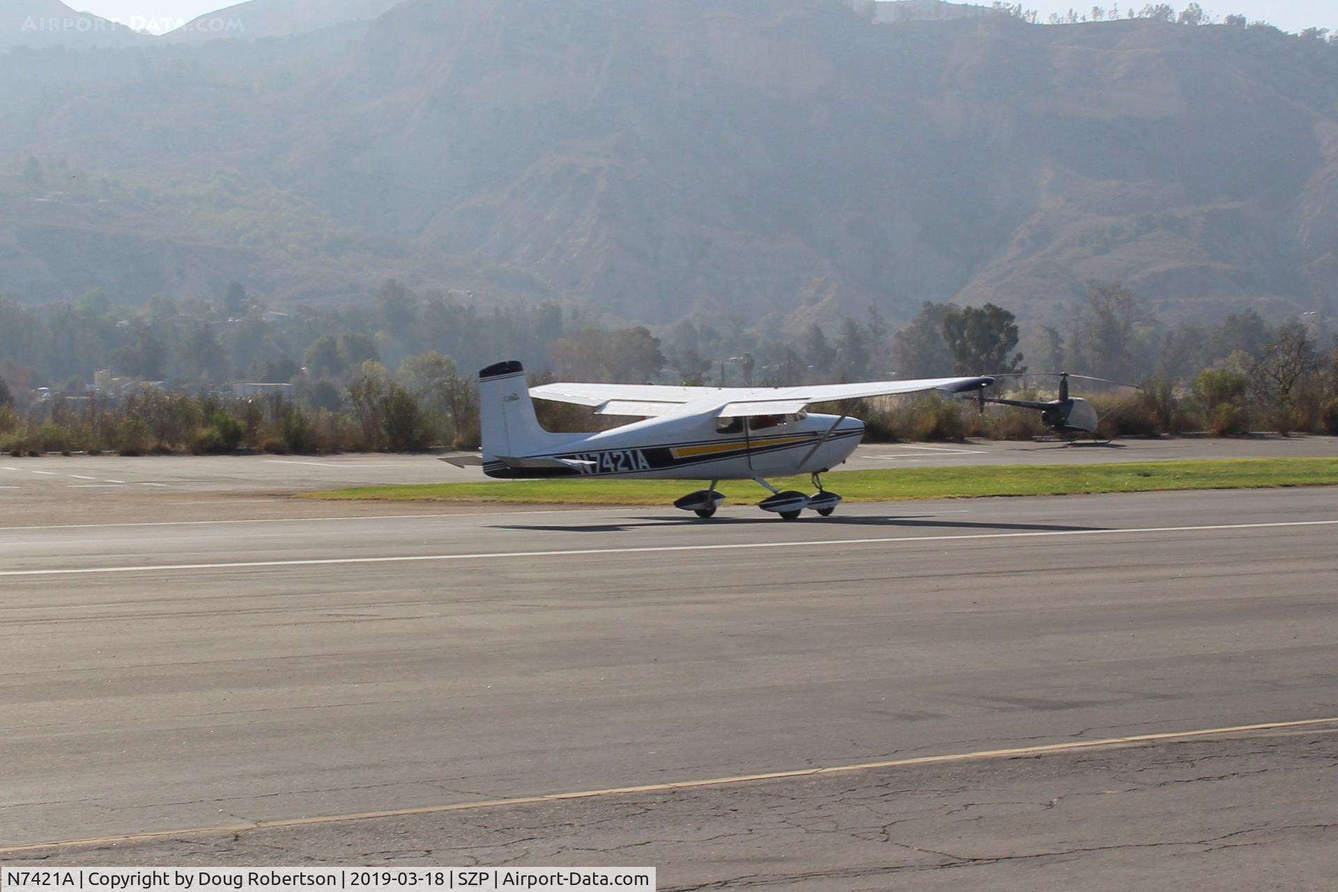 N7421A, 1956 Cessna 172 C/N 29521, 1956 Cessna 172, Continental O-300 145 Hp, landing roll Rwy 22. First year of production and NOT a Skyhawk.