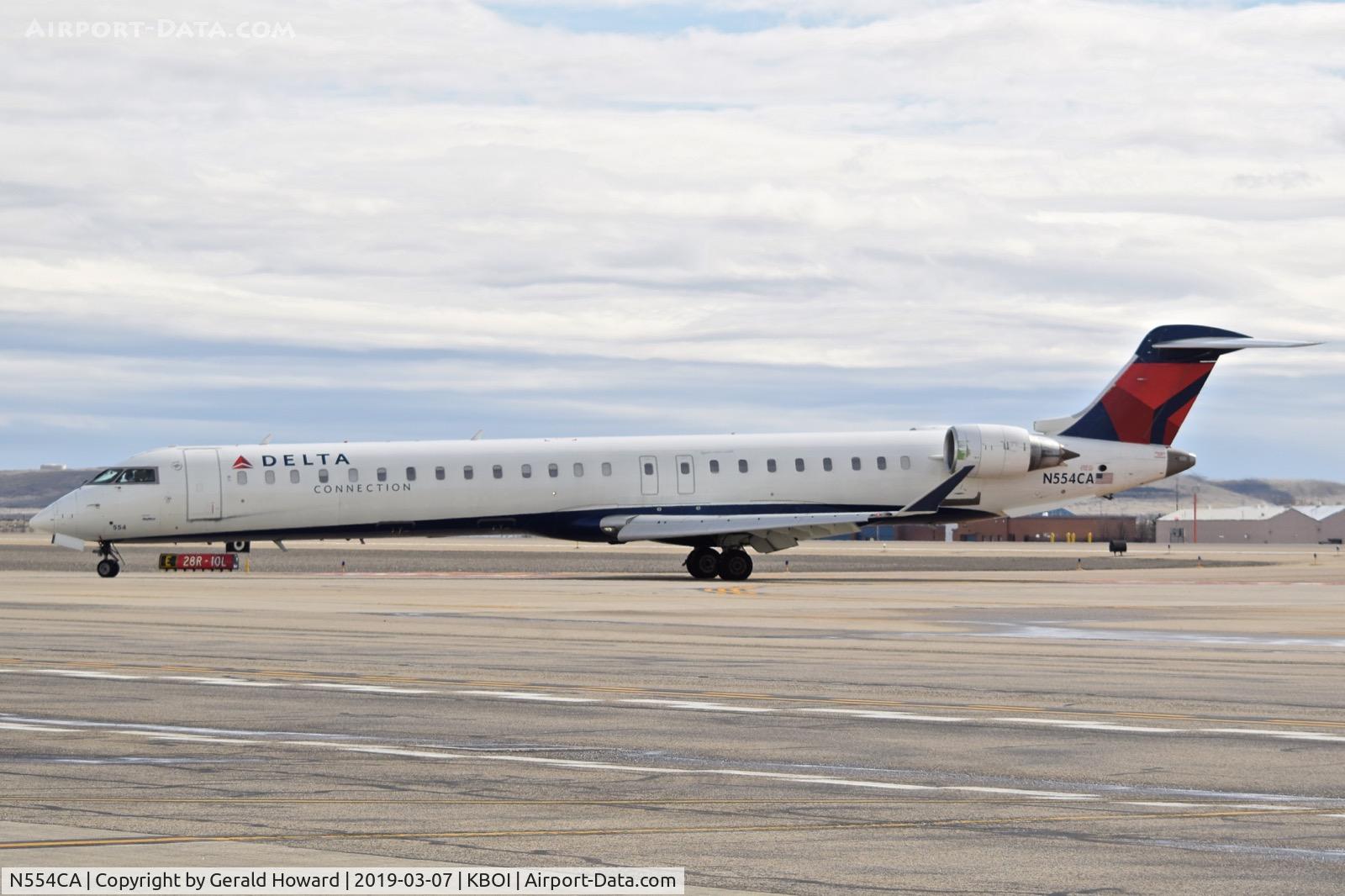 N554CA, 2008 Bombardier CRJ-900ER (CL-600-2D24) C/N 15168, On Echo from RWY 28R.