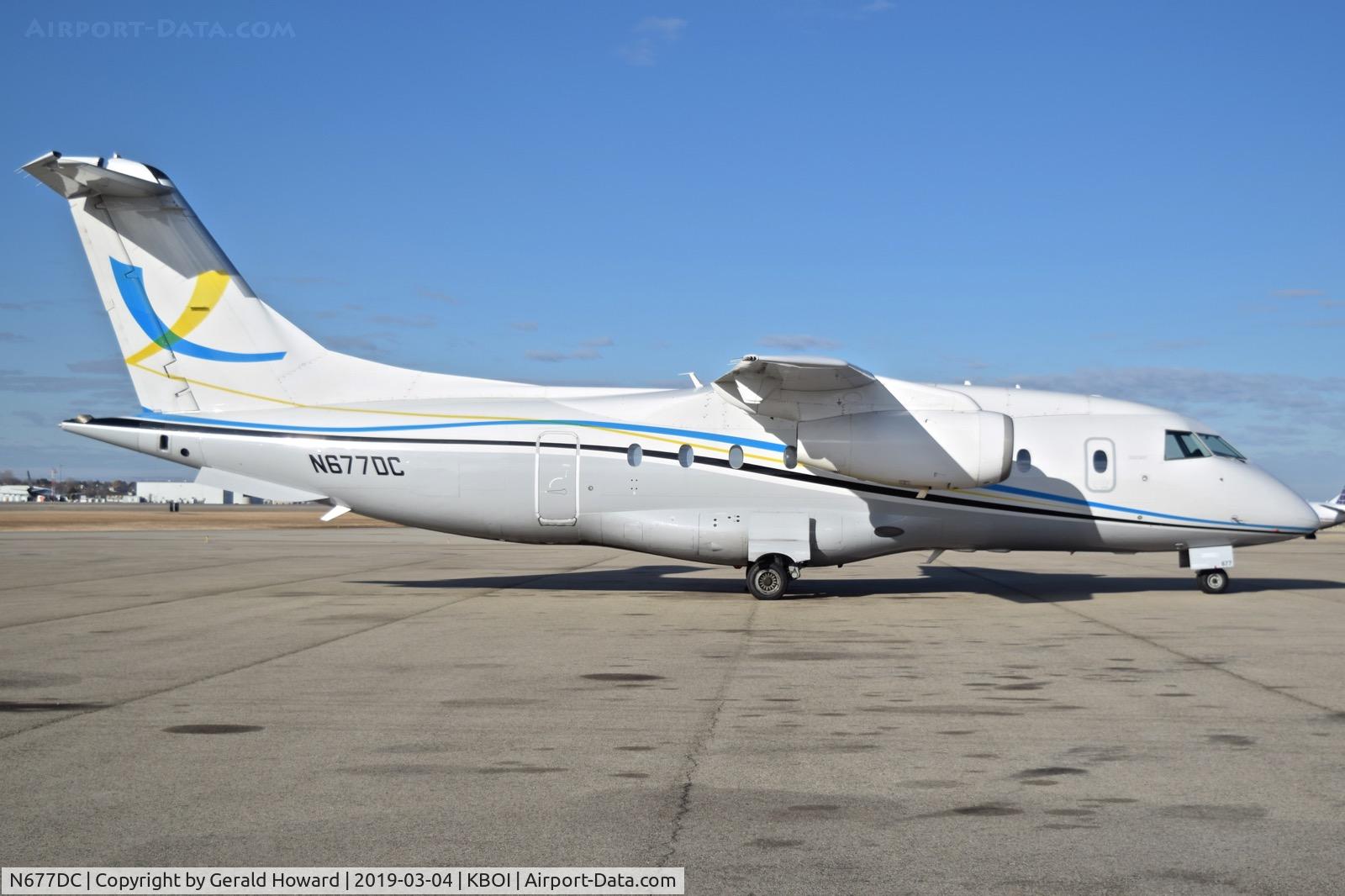 N677DC, 1999 Fairchild Dornier 328-300 328JET C/N 3126, Parked on the north GA ramp.