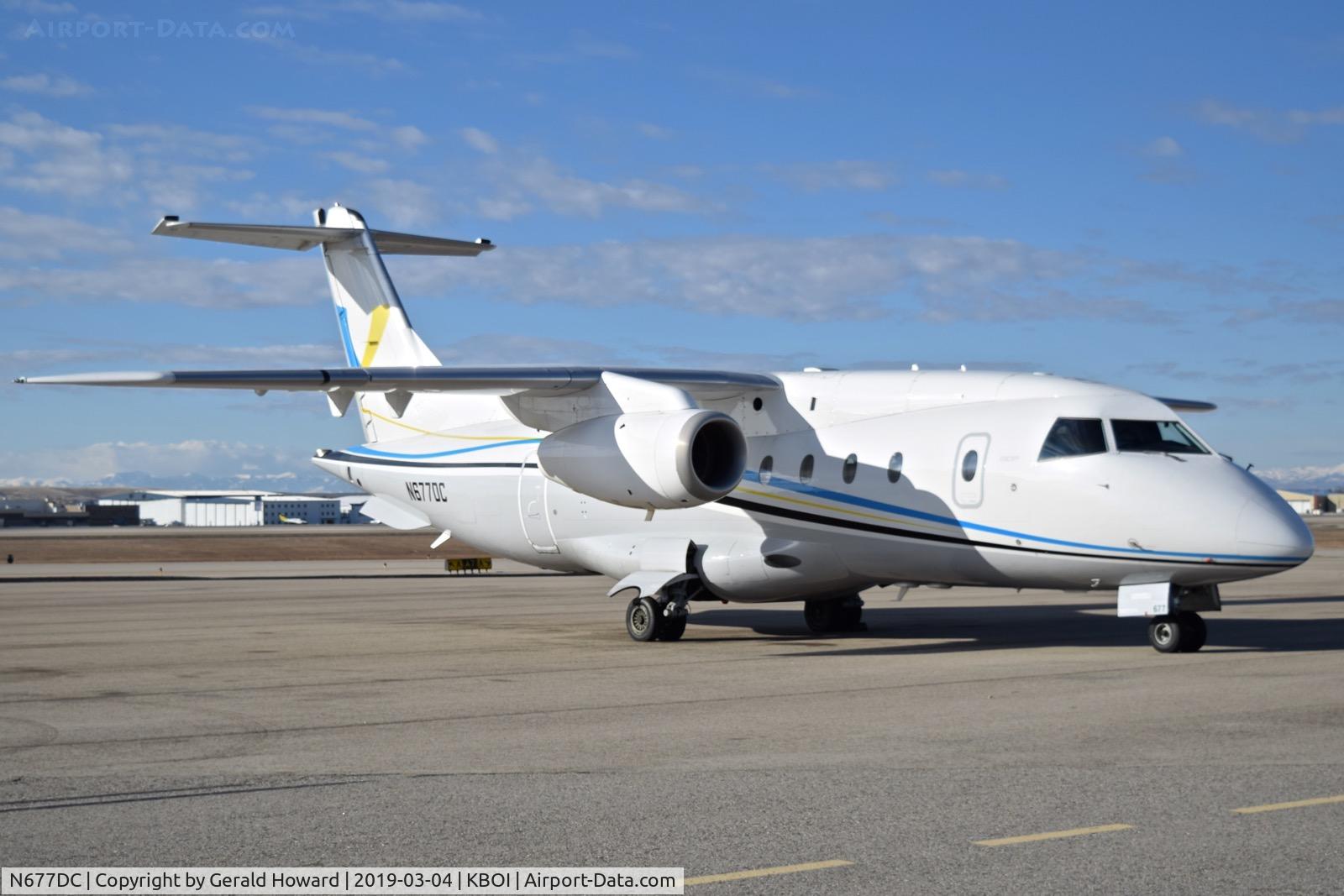 N677DC, 2008 Diamond DA-20C-1 Eclipse C/N C0477, Parked on the north GA ramp. 1999 Fairchild Dornier 328-300 328JET, c/n 3126