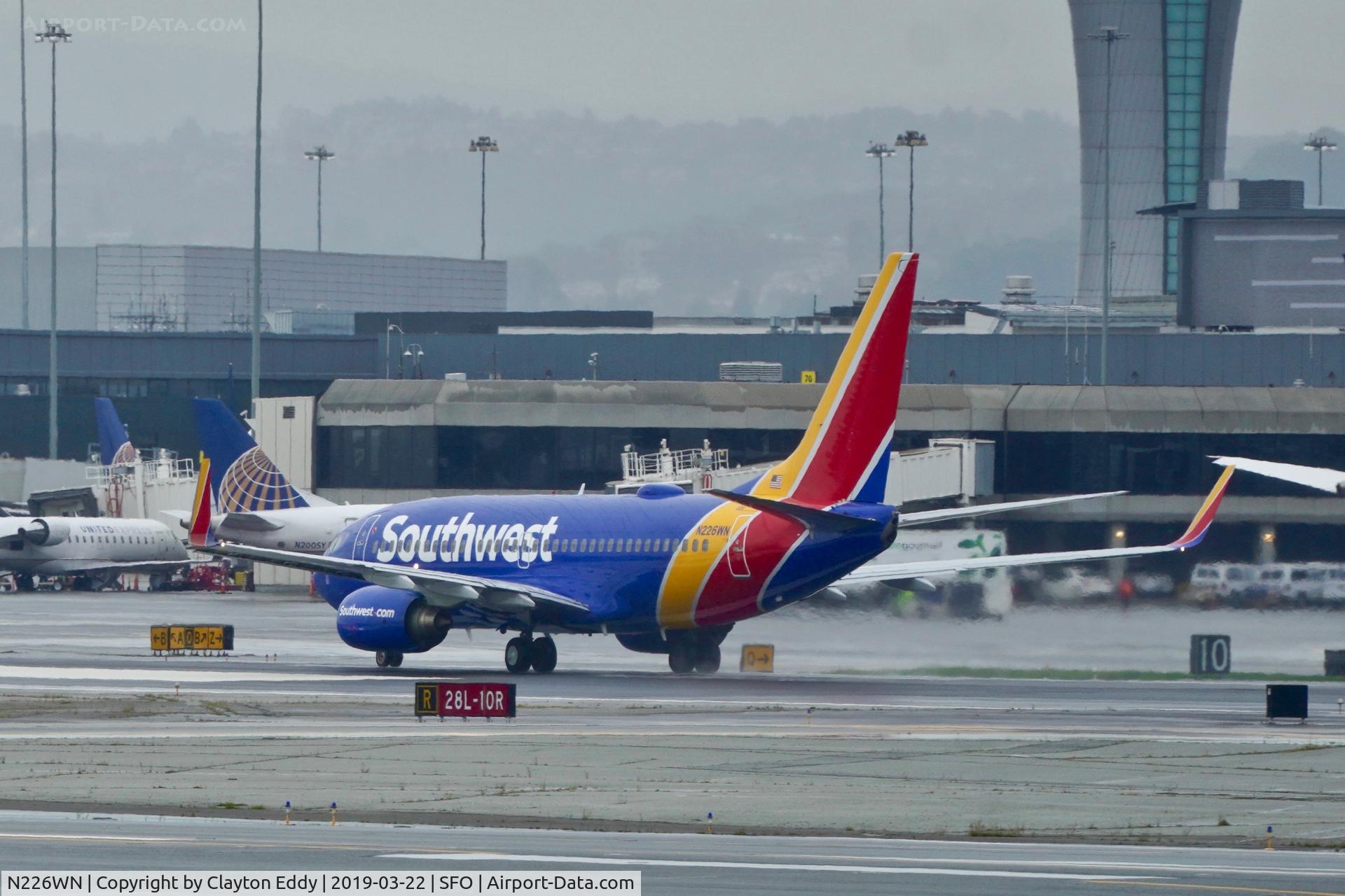 N226WN, 2005 Boeing 737-7H4 C/N 32494, Departing runway 10 at SFO 2019.