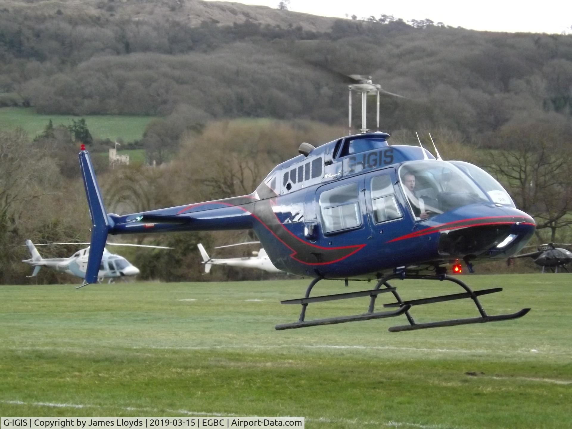 G-IGIS, 1975 Bell 206B JetRanger II C/N 1669, Arriving at Cheltenham Helipad to pick up the pax after the Cheltenham Gold Cup.
