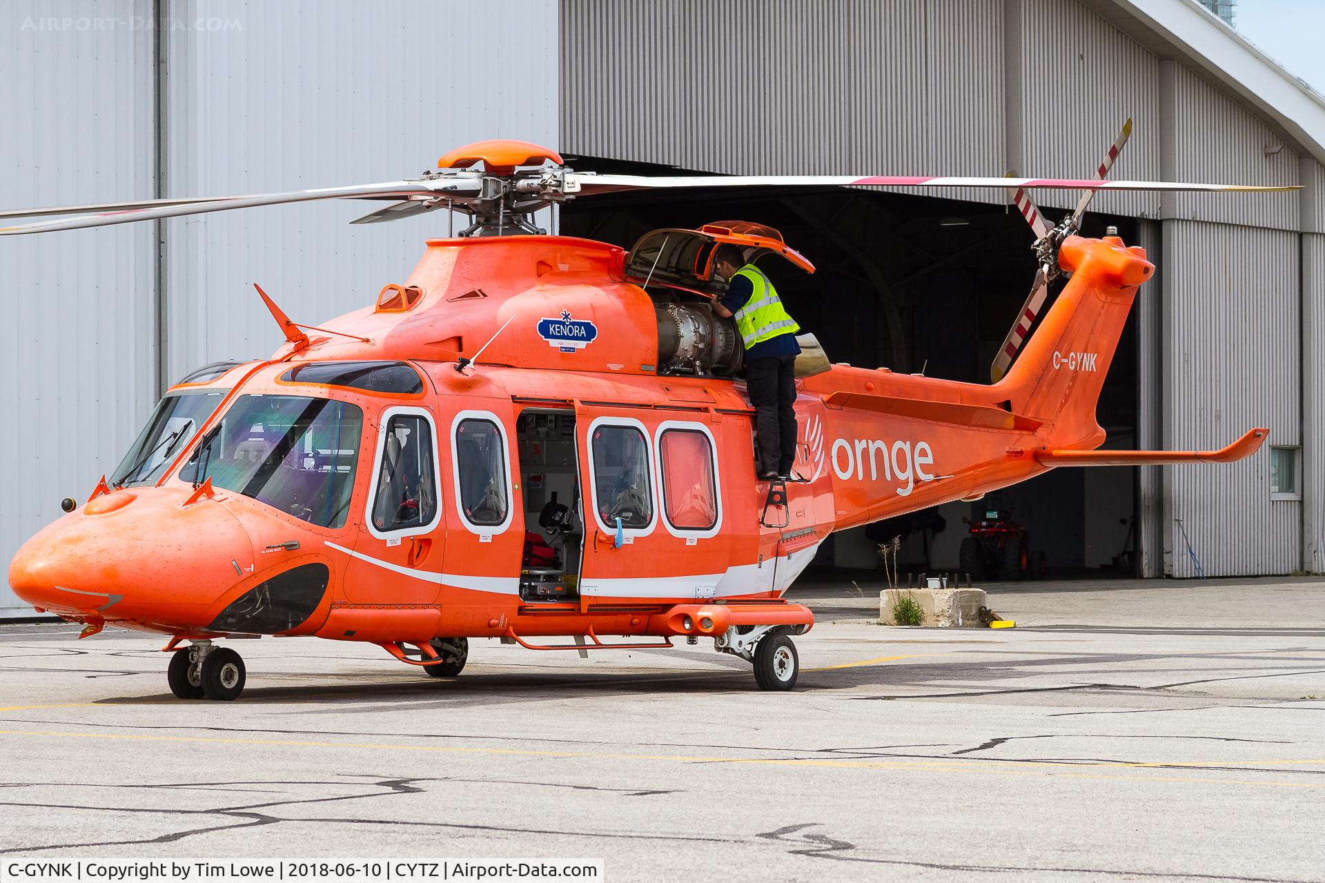 C-GYNK, 2010 AgustaWestland AW-139 C/N 41236, Mechanic working on the aircraft.