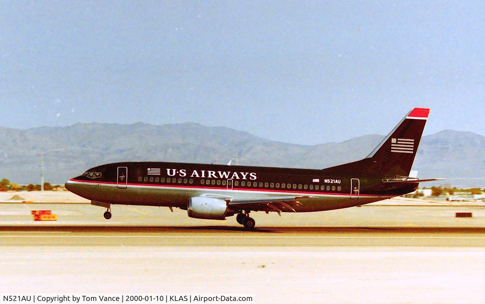 N521AU, 1988 Boeing 737-3B7 C/N 23856, Las Vegas arrival on 25L - from the E Sunset Ave Airpark