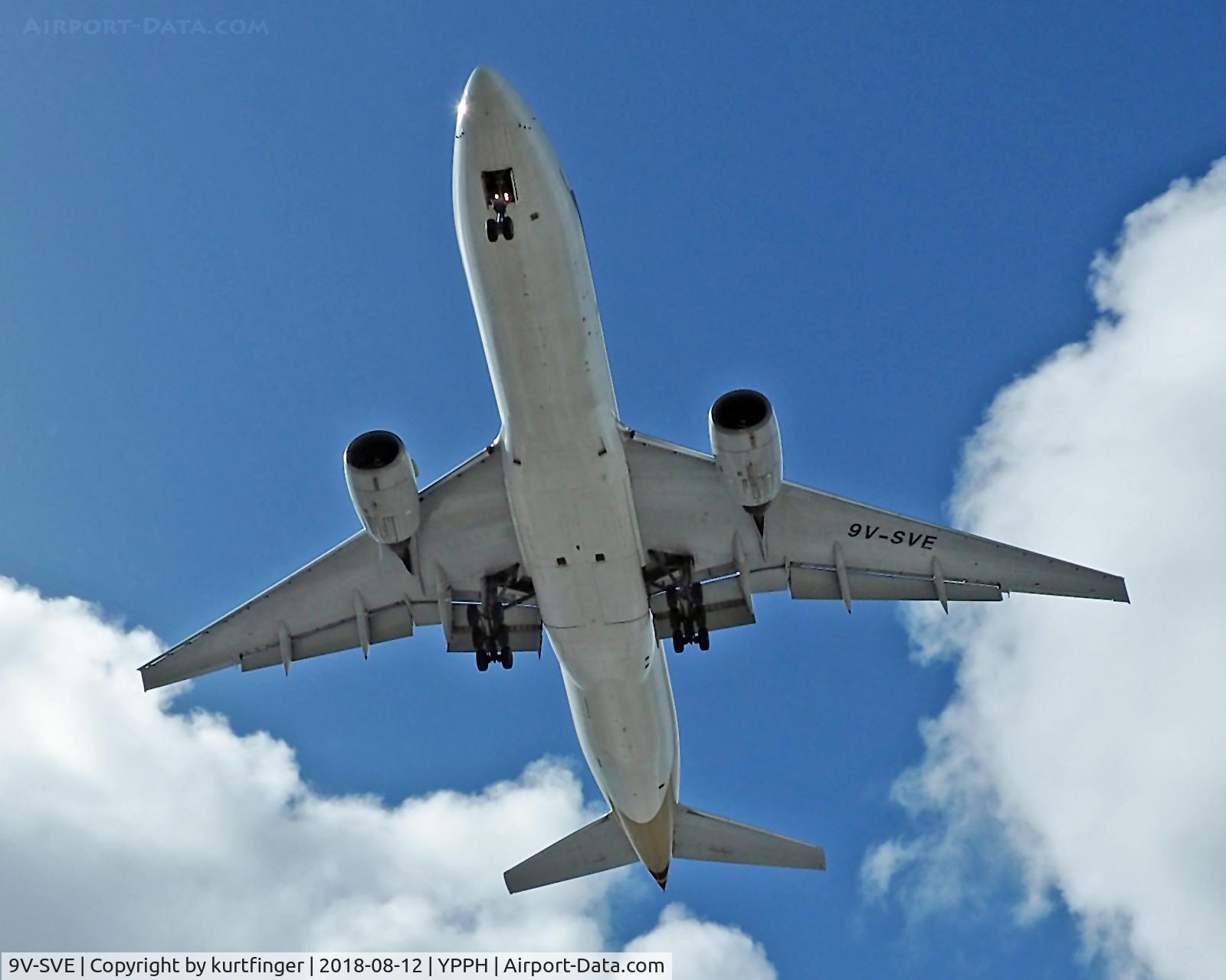 9V-SVE, 2001 Boeing 777-212/ER C/N 30870, Trailed a new location for taking photos. Used my Zuiko 12-50mm lens. The approached is on runway 24, YPPH. View of the approaching a/c is obstructed by trees. Little time for the shots.