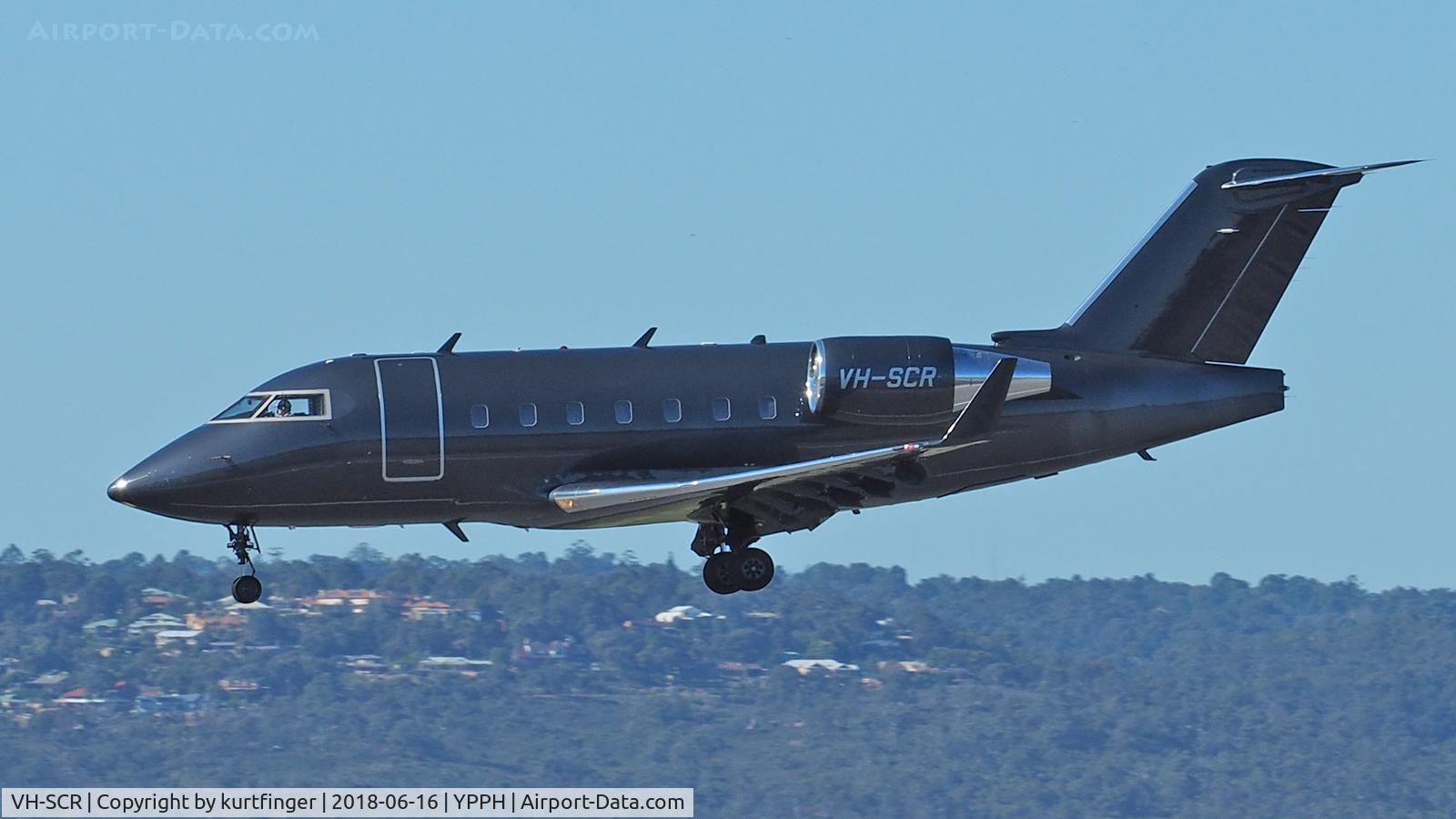 VH-SCR, 2003 Bombardier Challenger 604 (CL-600-2B16) C/N 5557, The photo is taken from the Dunreath viewing platform, Perth International Airport. Bombardier CL-600-2B16 VH-SCR