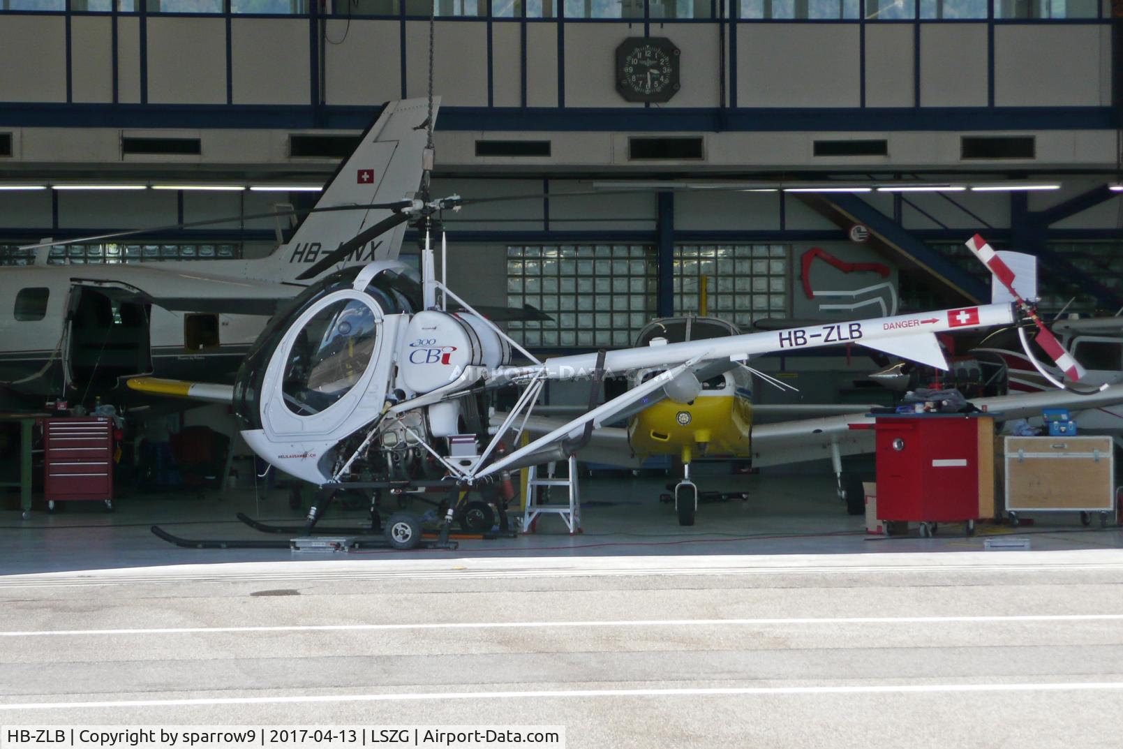 HB-ZLB, 2002 Schweizer 269C-300 C/N S-0224, In front of maintenance hangar at Grenchen.