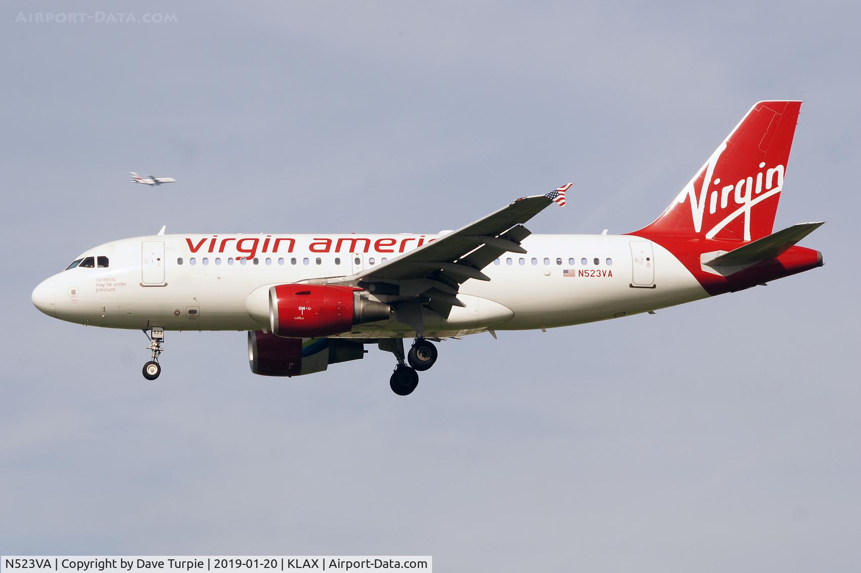N523VA, 2007 Airbus A319-112 C/N 3181, Am Emirates Airbus A.380 can be seen a few miles away on its downwind leg.