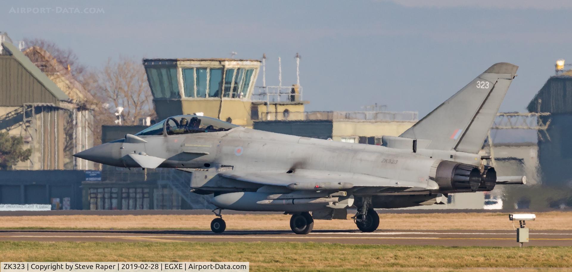 ZK323, 2011 Eurofighter EF-2000 Typhoon FGR4 C/N BS084/322, Taxying back in at RAF Leeming with the tower in the background.