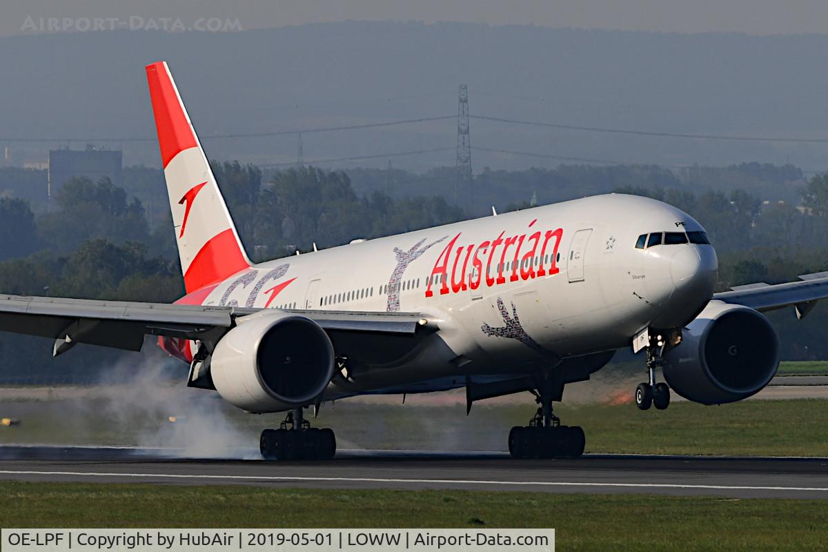 OE-LPF, 2001 Boeing 777-2Q8/ER C/N 28692, Touching down RWY 34 on a sunny but stormy day