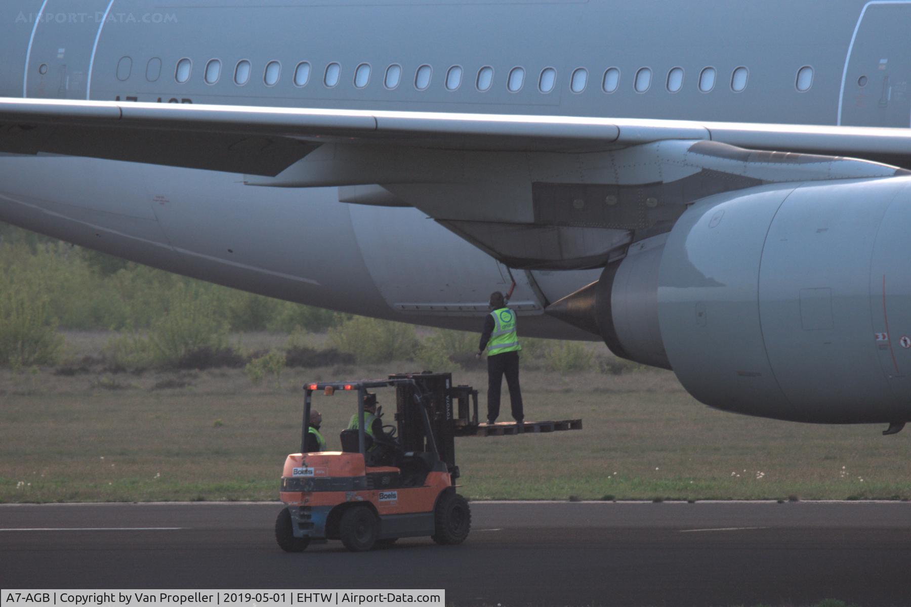 A7-AGB, 2005 Airbus A340-642X C/N 715, Opening the rear cargo door of Qatar Airways Airbus A340-642 on the runway of Twente airport, the Netherlands. It will be scrapped here by AELS.