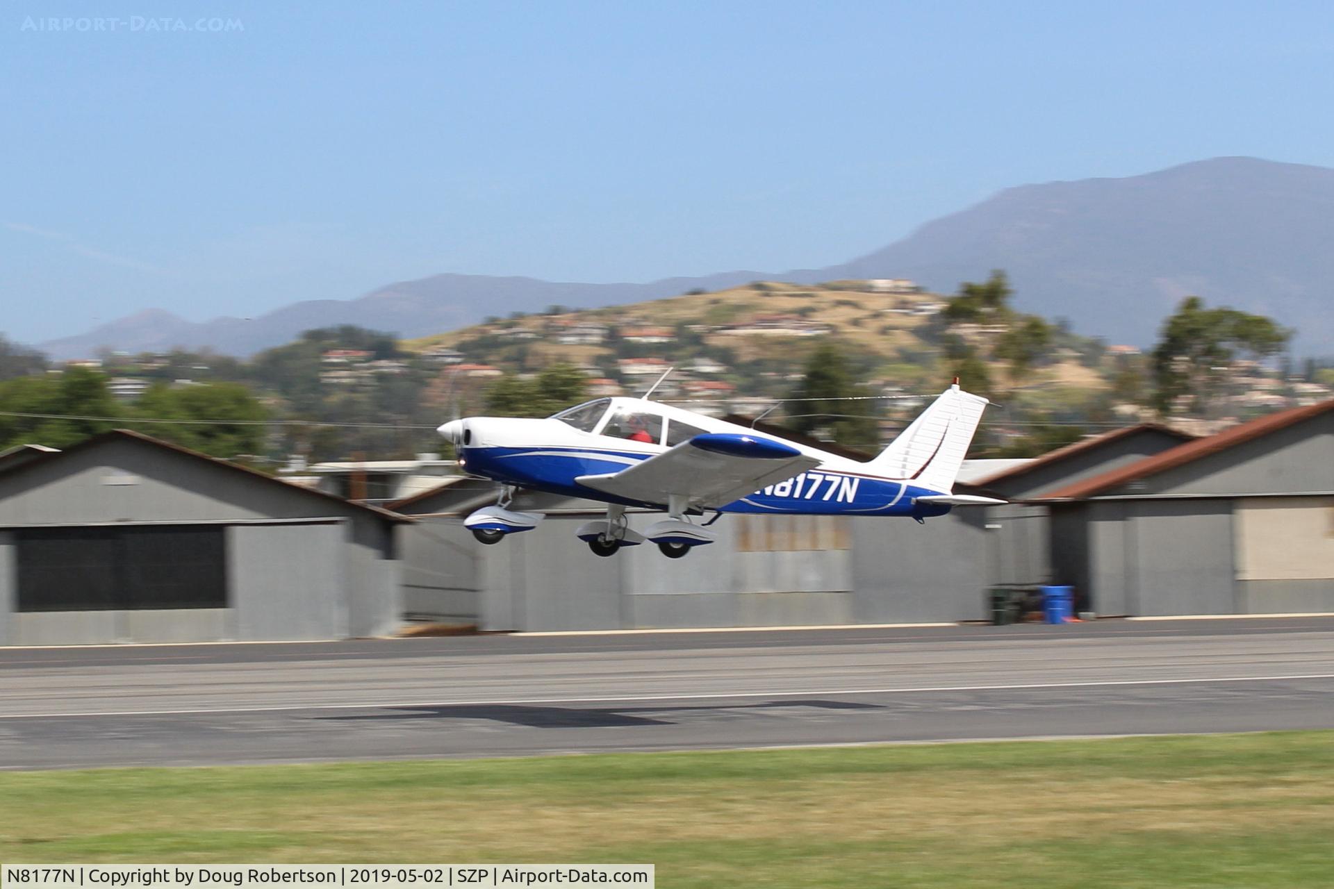 N8177N, 1968 Piper PA-28-140 C/N 28-25373, 1968 Piper PA-28-140 Cherokee 140, Lycoming O-320-E2A 150 Hp, rear seats became optional in 1966, takeoff climb Rwy 22. Panned shot.
