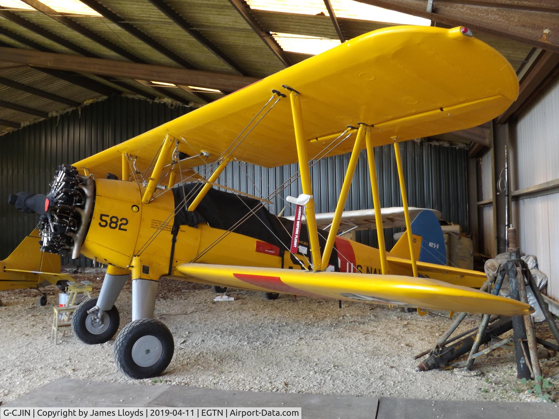 G-CJIN, 1943 Boeing E75N1 C/N 75-4826, Parked inside her hanger at Enstone Airfield.