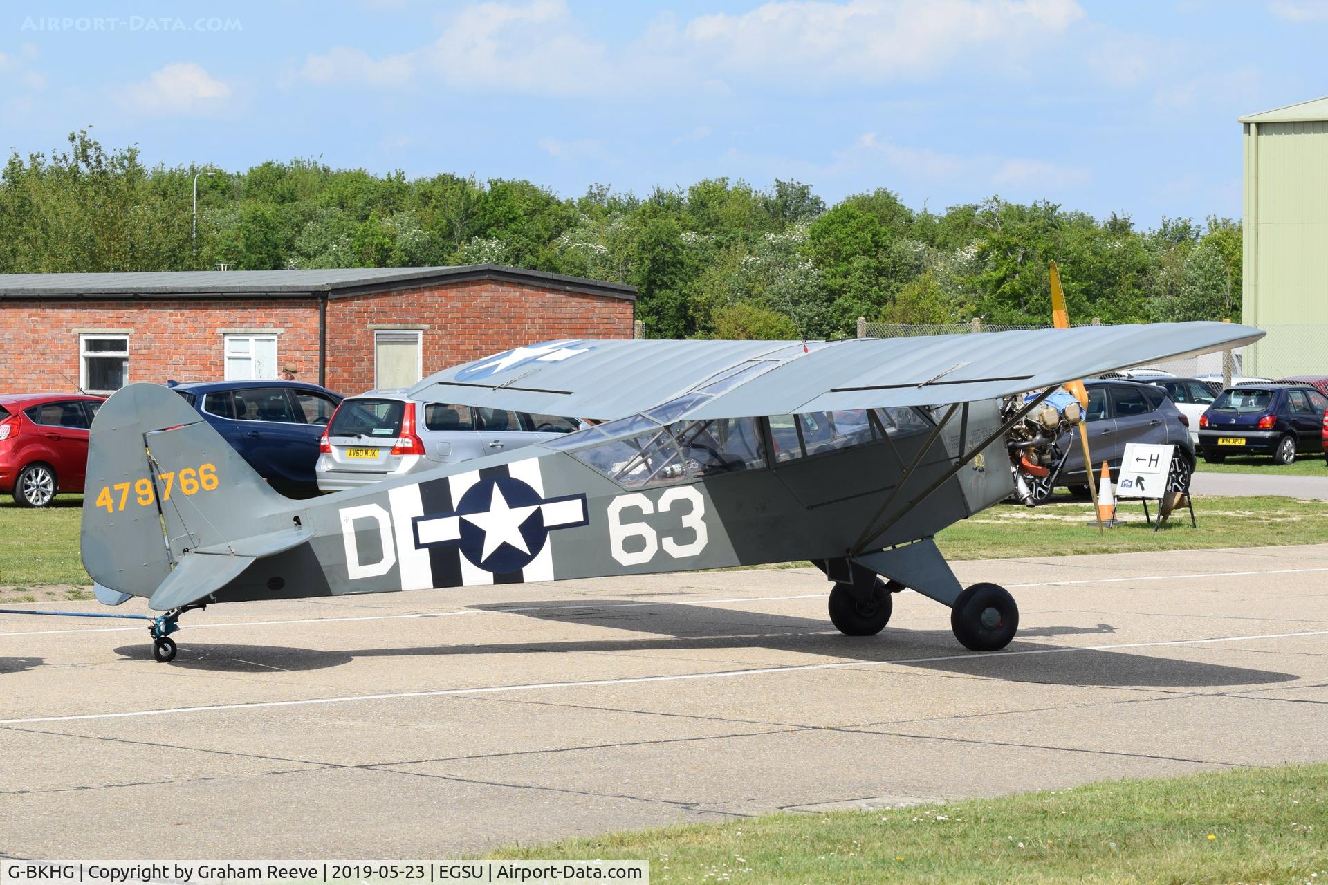 G-BKHG, 1942 Piper L-4H Grasshopper (J3C-65D) C/N 12062, Under tow at Duxford.