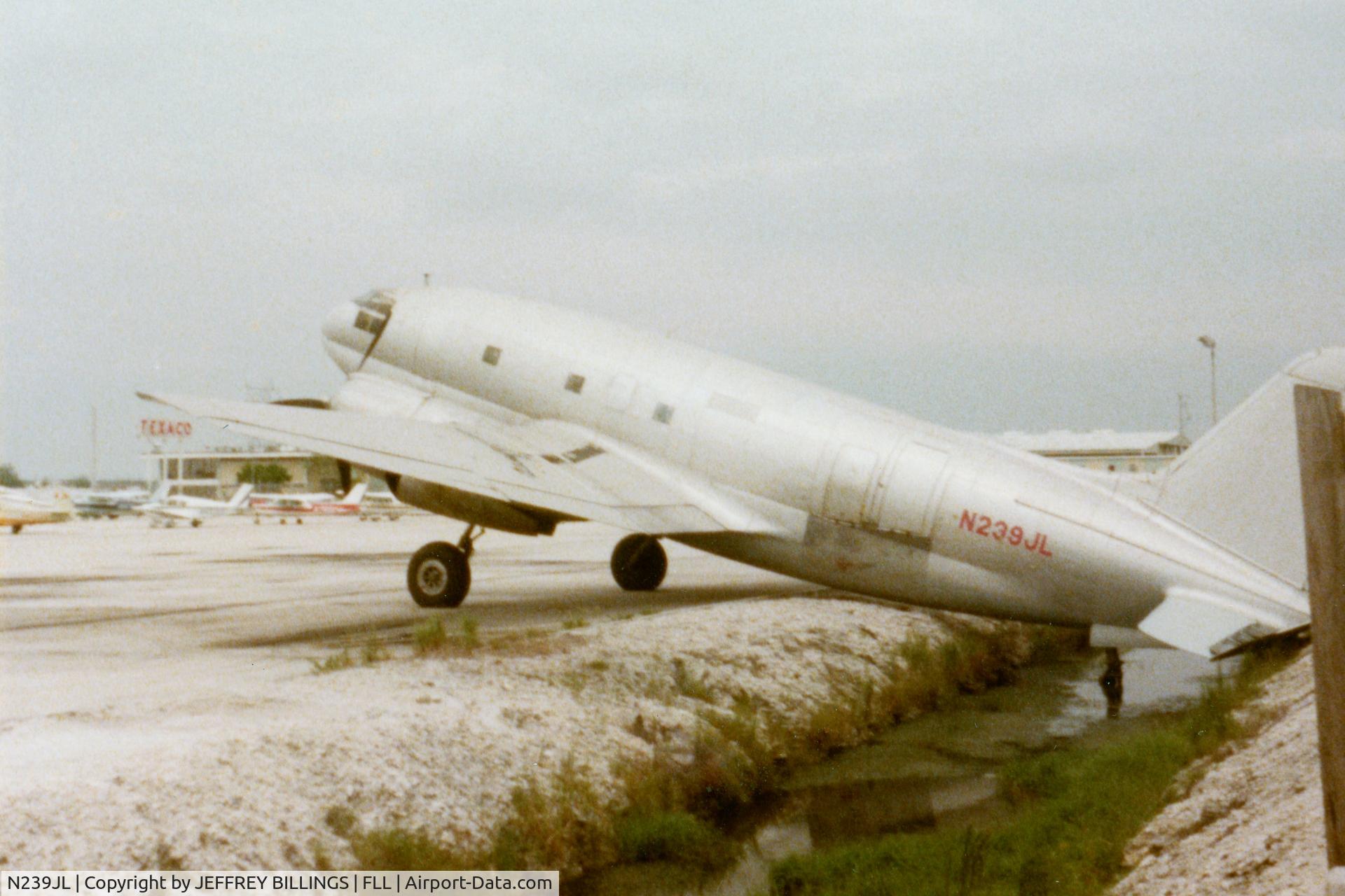 N239JL, 1945 Curtiss C-46F Commando C/N 22375, Taken at Ft. Lauderdale International Airport in 1978 after a storm had blown it into a drainage canal.