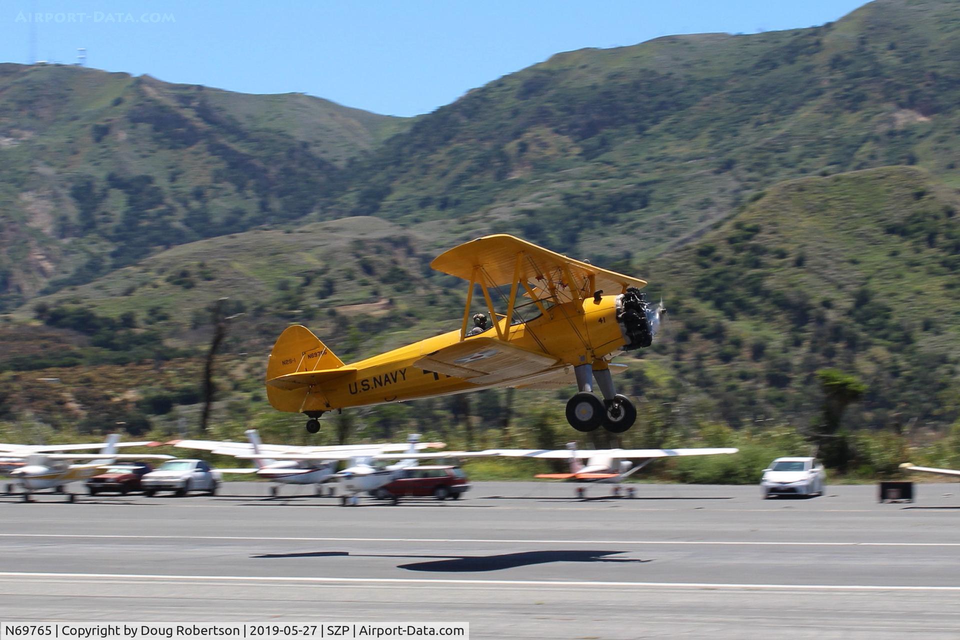 N69765, 1941 Boeing A75N1 (PT17) C/N 75-1044, 1941 Boeing Stearman A75N1 as Navy N2S1, Continental W670 220 Hp Radial, takeoff climb Rwy 22