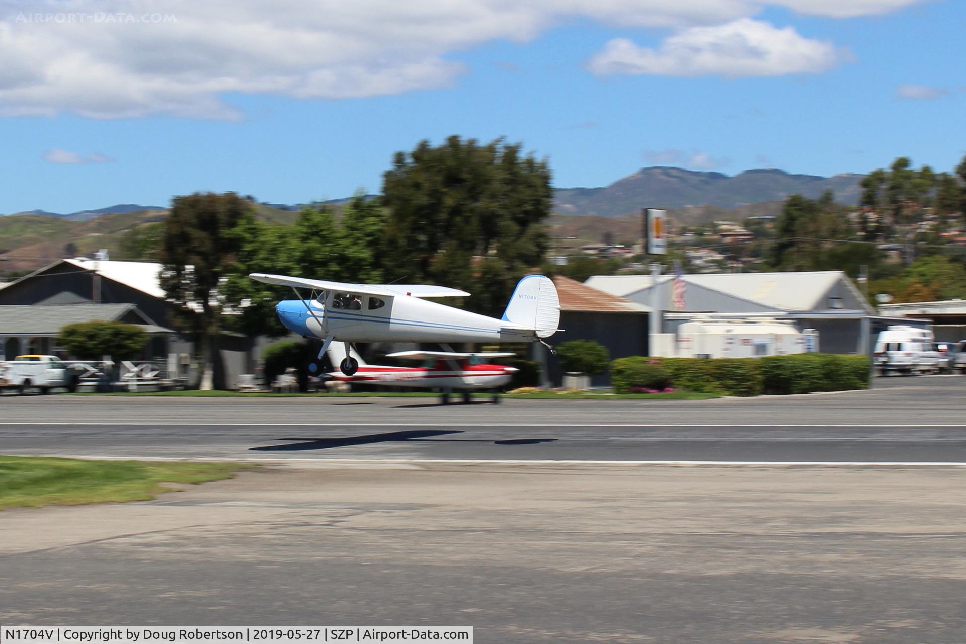 N1704V, Cessna 140 C/N 13889, Cessna 140, no further registration info, takeoff climb Rwy 22-panned shot