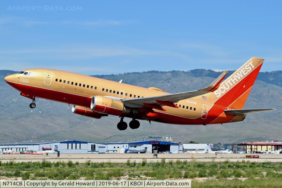 N714CB, 1998 Boeing 737-7H4 C/N 27848, Take off from RWY 28L. Just a few of the old classic paint jobs left.