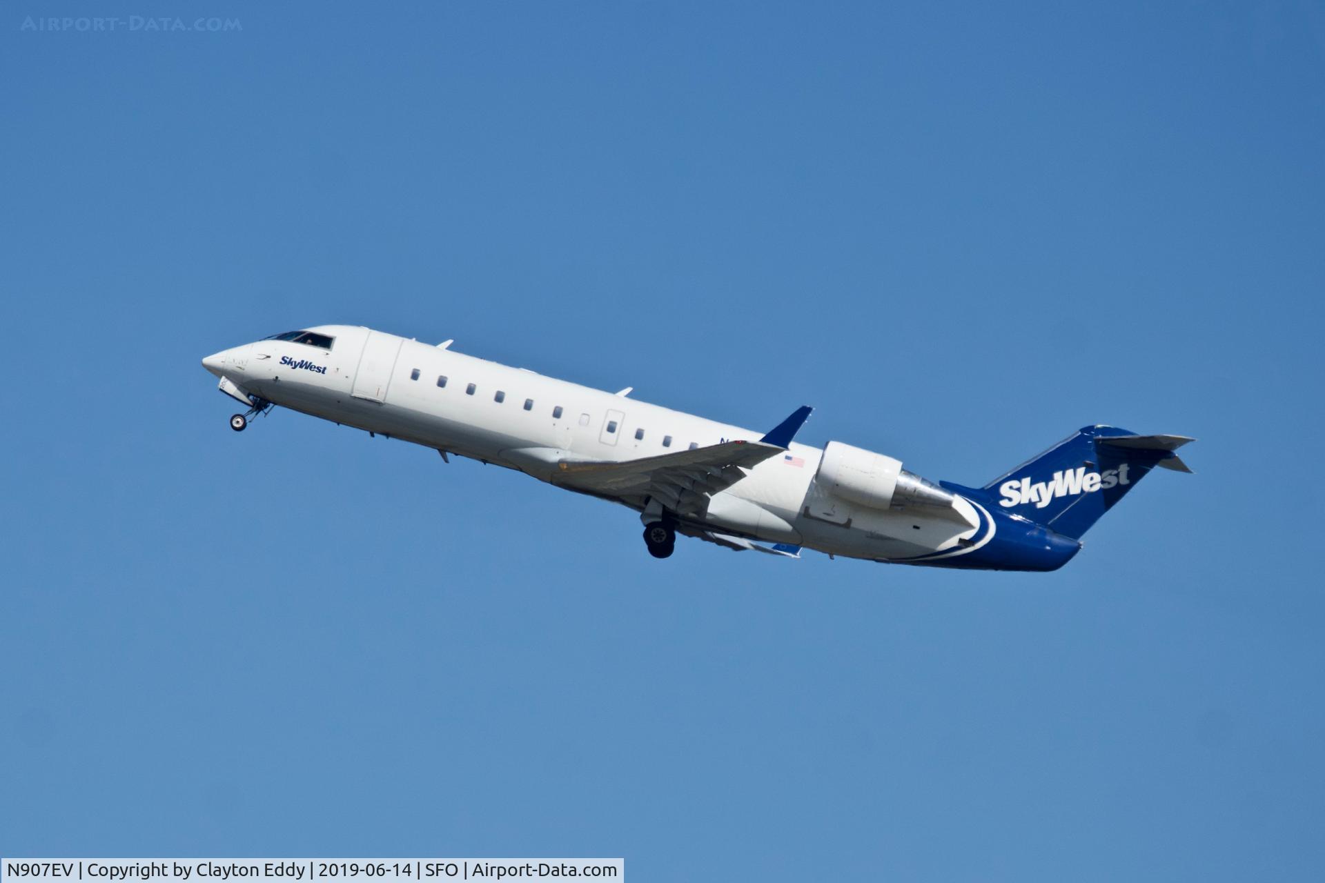 N907EV, 2002 Bombardier CRJ-200ER (CL-600-2B19) C/N 7648, Departing runway 01 SFO 2019.