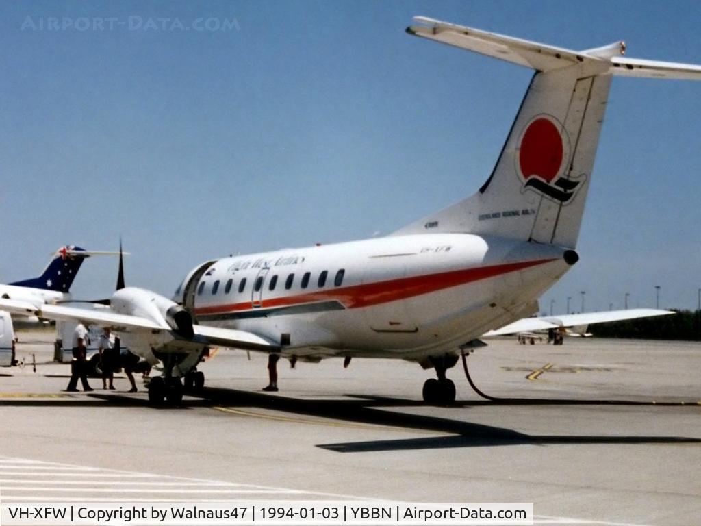 VH-XFW, 1990 Embraer EMB-120ER Brasilia C/N 120181, Low Res rear Port side view of Flight West EMB120RT Brasilia VH-XFW (Cn 120181), shown in original Flight West livery, at Brisbane Airport YBBN on 03Jan1994. Photo taken after a 0.7 hour flight from Bundaberg in this aircraft.