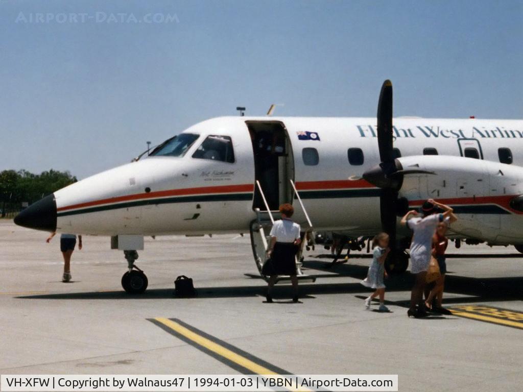 VH-XFW, 1990 Embraer EMB-120ER Brasilia C/N 120181, Low Res forward fuselage view of Flight West EMB120RT Brasilia VH-XFW (Cn 120181), shown in original Flight West livery, at Brisbane Airport YBBN on 03Jan1994. Photo taken after a 0.7 hour flight from Bundaberg in this aircraft.