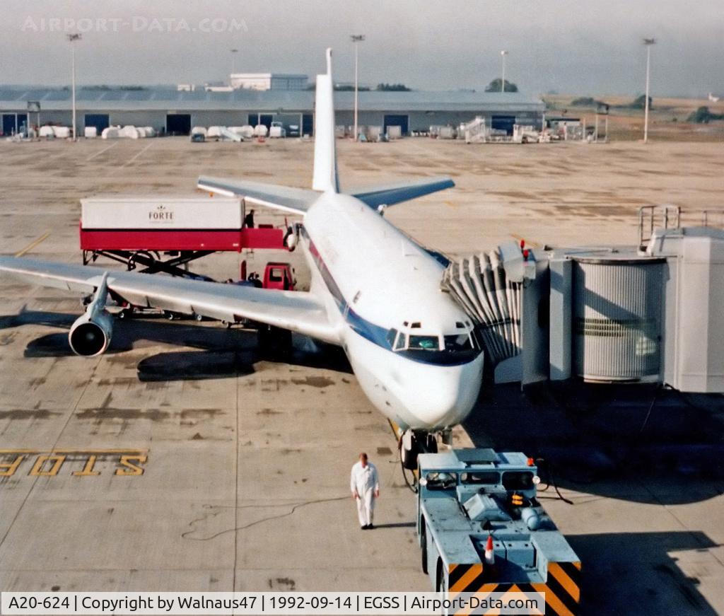 A20-624, 1968 Boeing 707-338C C/N 19624, RAAF 33 Squadron Boeing 707-338C(KC) A20-624 (in original White livery) awaiting passengers at Stansted Airport UK on 14Sep1992. Catering supplies are being loaded at rear, before a 7.7 hour flight to Dulles Washington KIAD.