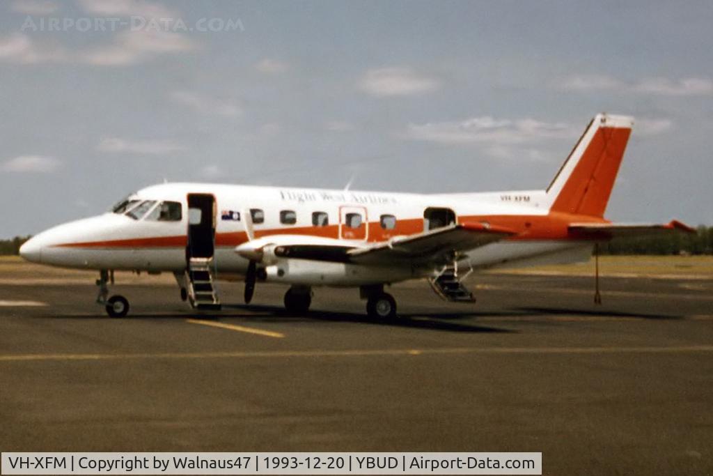 VH-XFM, 1978 Embraer EMB-110P2 Bandeirante C/N 110194, Rare Low Res Port side view of Flight West EMB-110P2 Bandierante VH-XFM, Cn 110194, shown in ad hoc Red/White Flight West livery, at Bundaberg Airport on 20Dec1993.